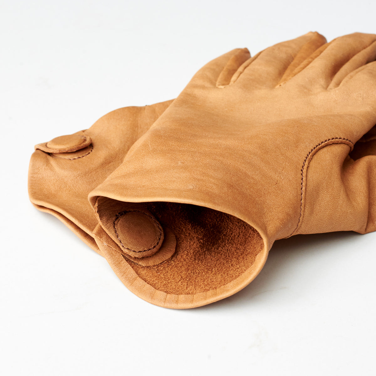 Inside. Leather gloves in tan saddle brown