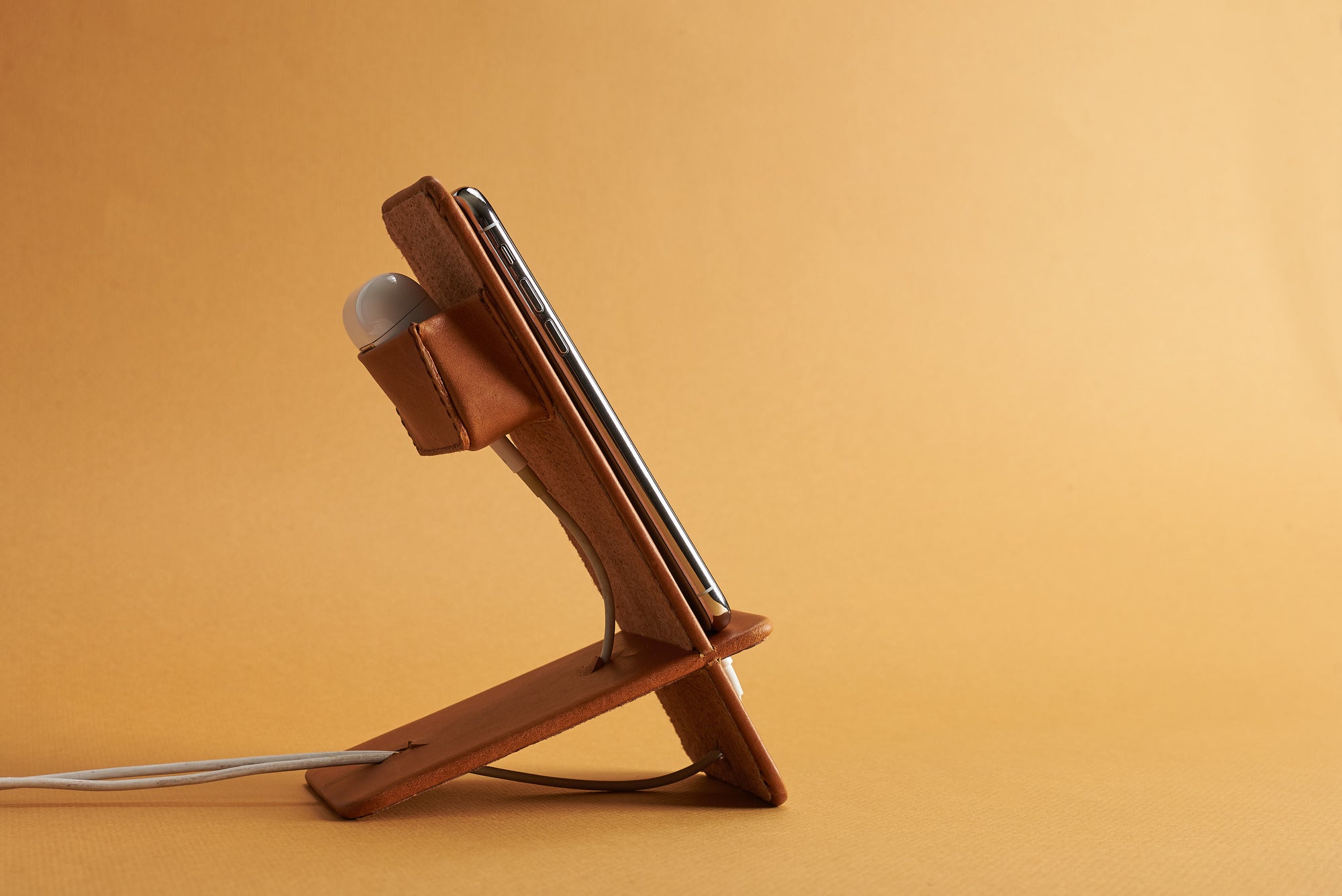 Earbuds holder. Leather Phone Stand Holder Tan by Capra Leather