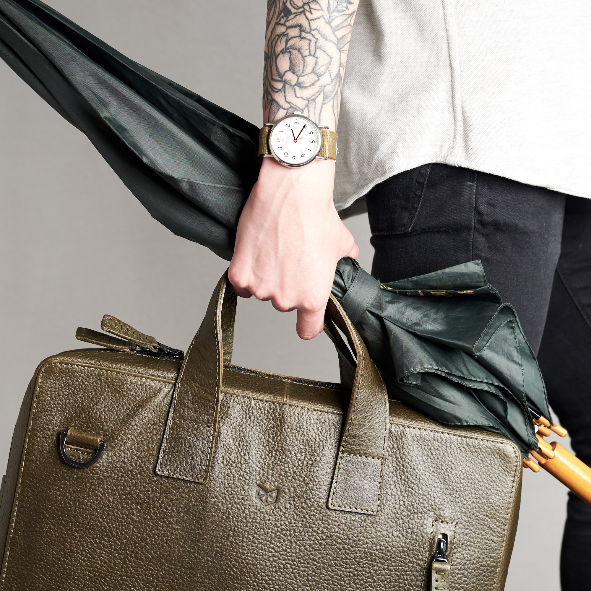 Roko green briefcase with umbrella. Style picture for briefcase by Capra Leather.