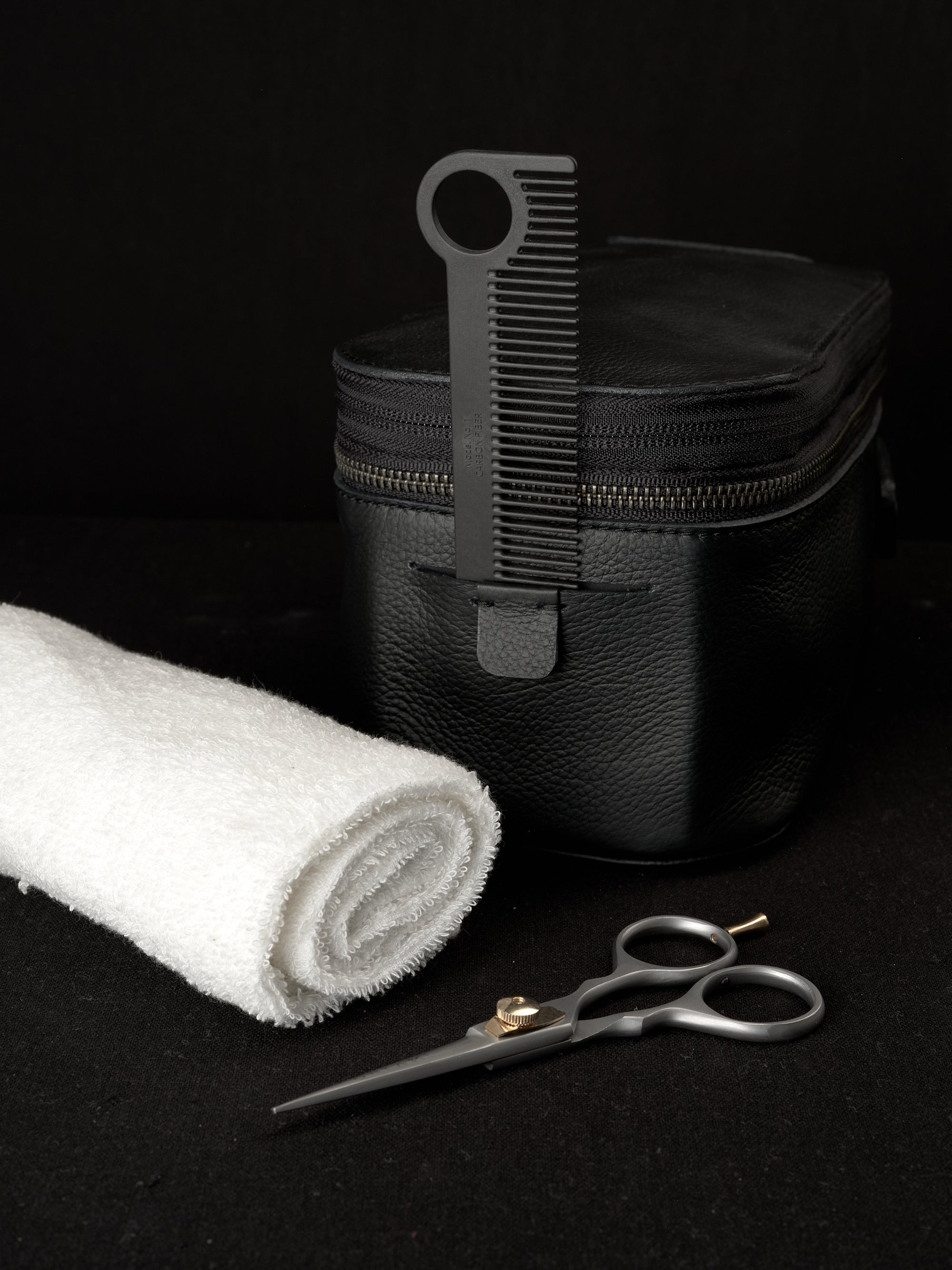 Black toiletry bag by Capra Leather