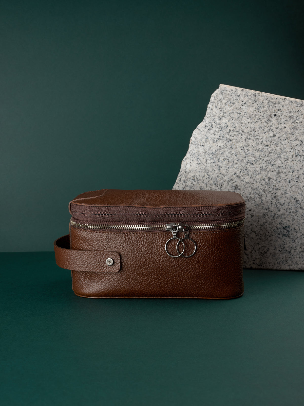 Brown leather toiletry bag by Capra