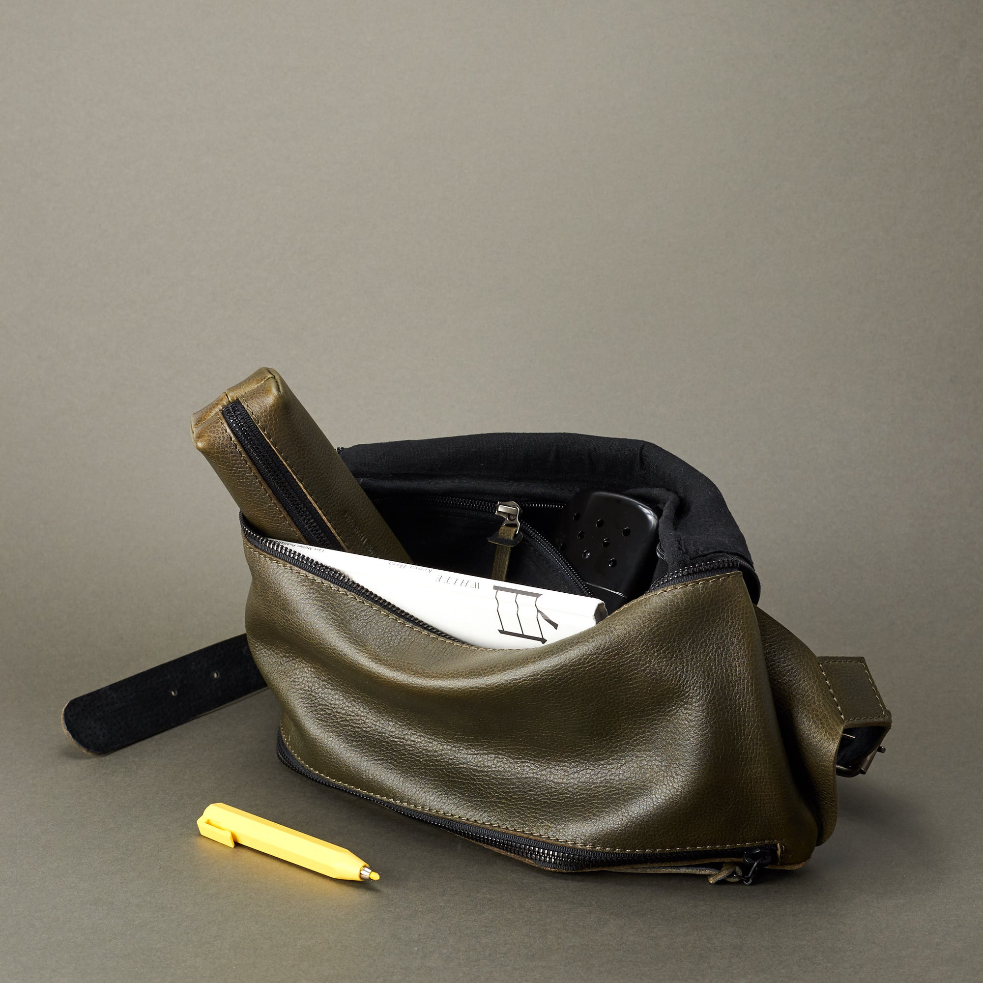 Linen inside. Fenek green sling bag for men by Capra Leather. Single strap waist bag.