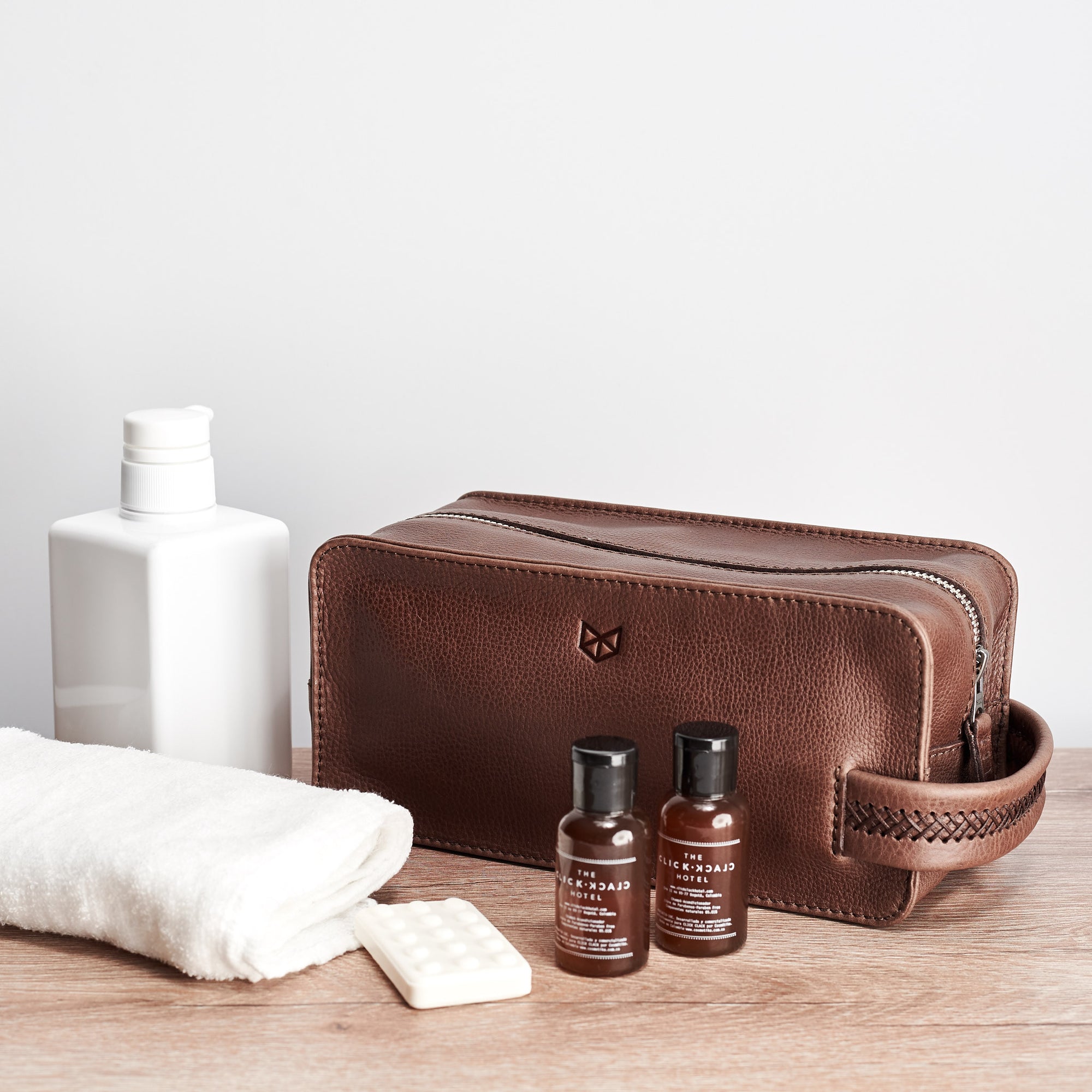 Dopp kit and toiletries. Brown leather toiletry, shaving bag with hand stitched handle