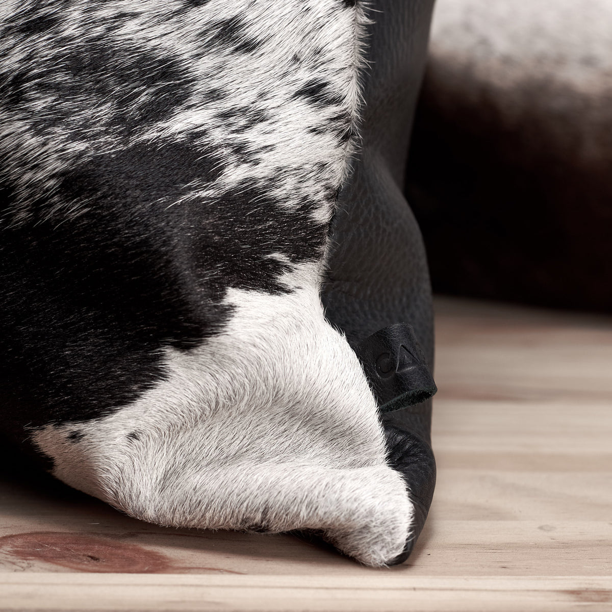 Texture close up. Black Dual Leather Cowhide Cushion. Couch decoration, lounge, bench, sofa cushion covers, custom size, pillow. 
