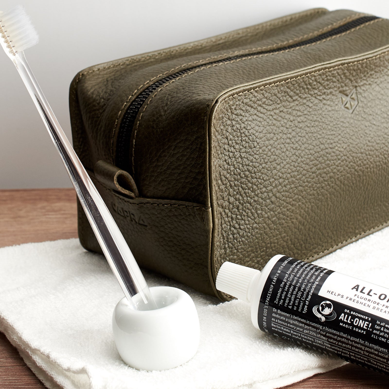 Style. Green leather toiletry, shaving bag with hand stitched handle. Groomsmen gifts