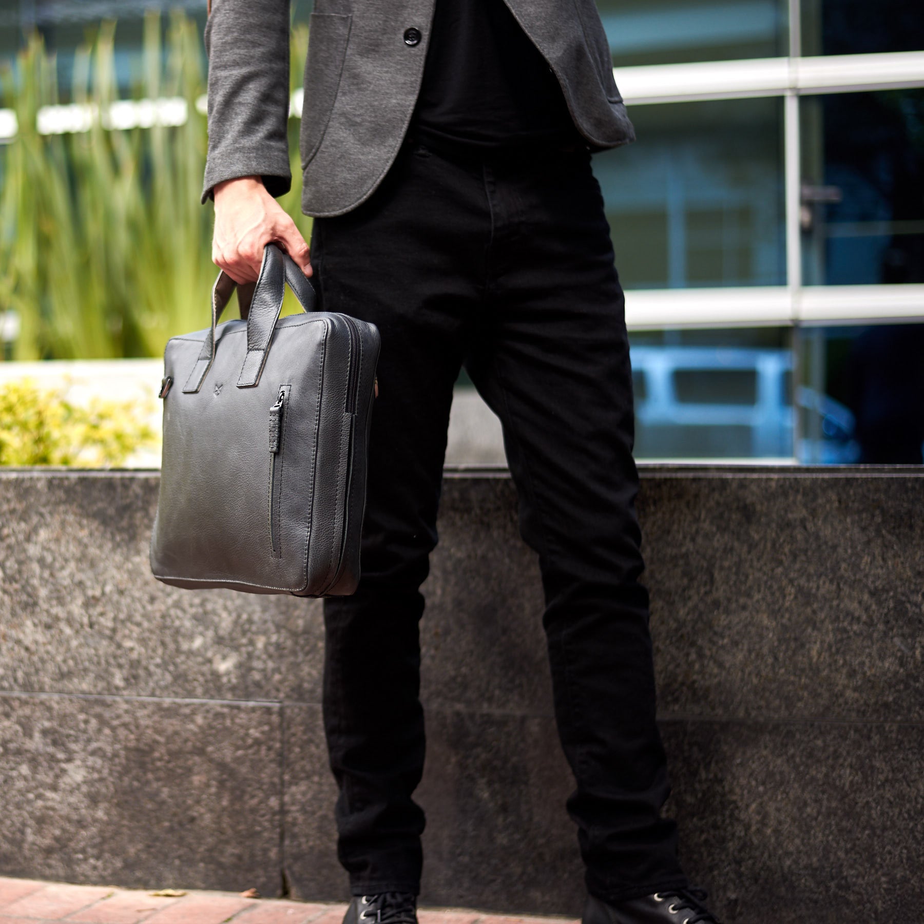 Front. Black leather soft briefcase for men. Unique mens workbag