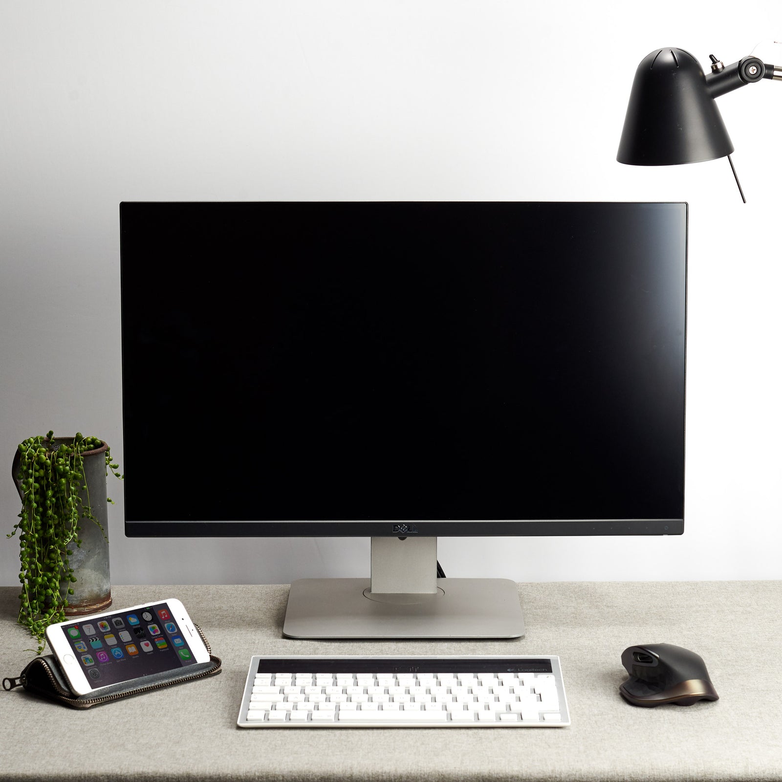 Office desk.  Grey leather case stand wallet for men. iPhone x, iPhone 10, iPhone 8 plus leather stand sleeve