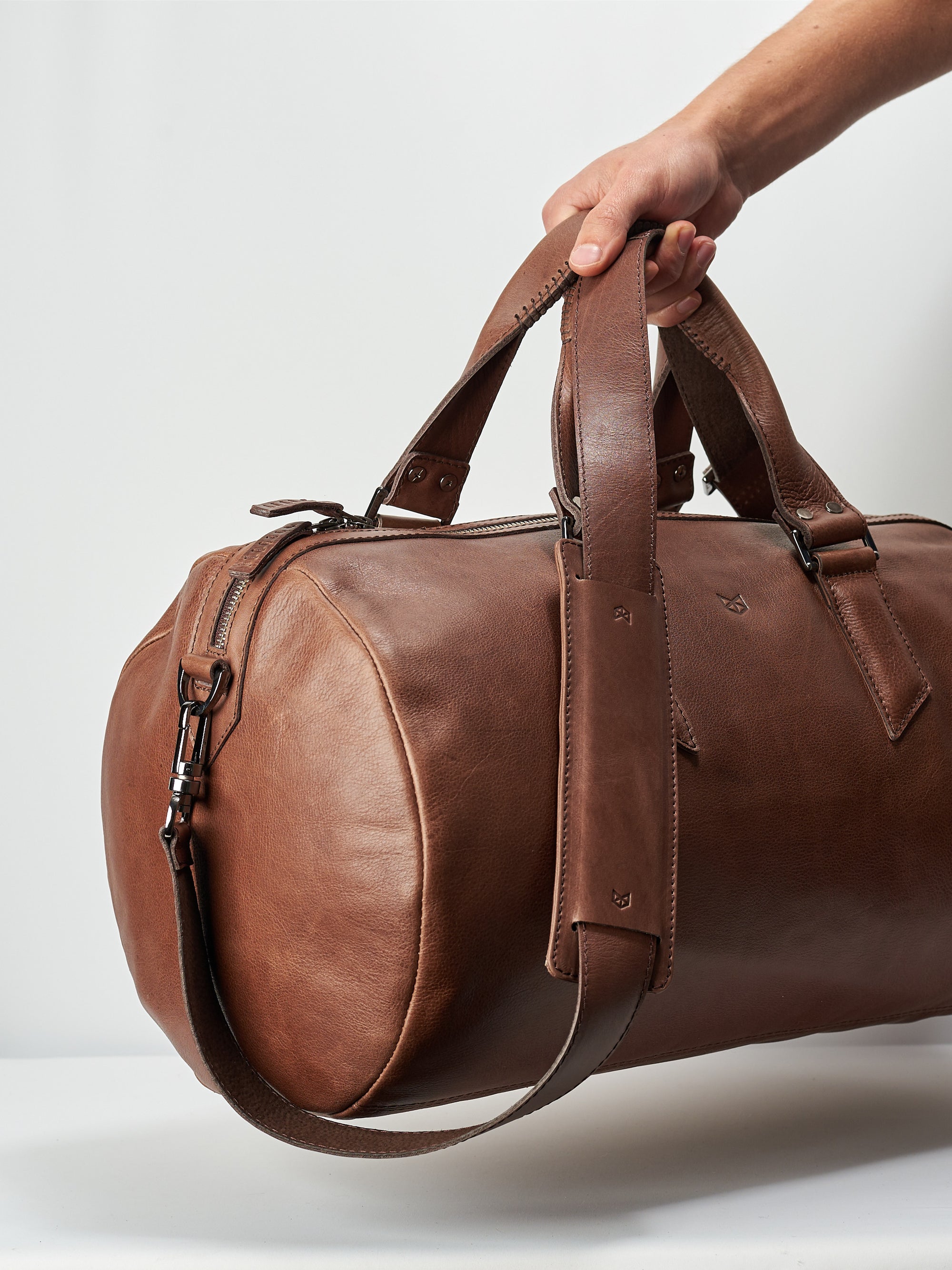 Style photo. Brown leather duffle bag for mens gifts. Shoulder gym bag