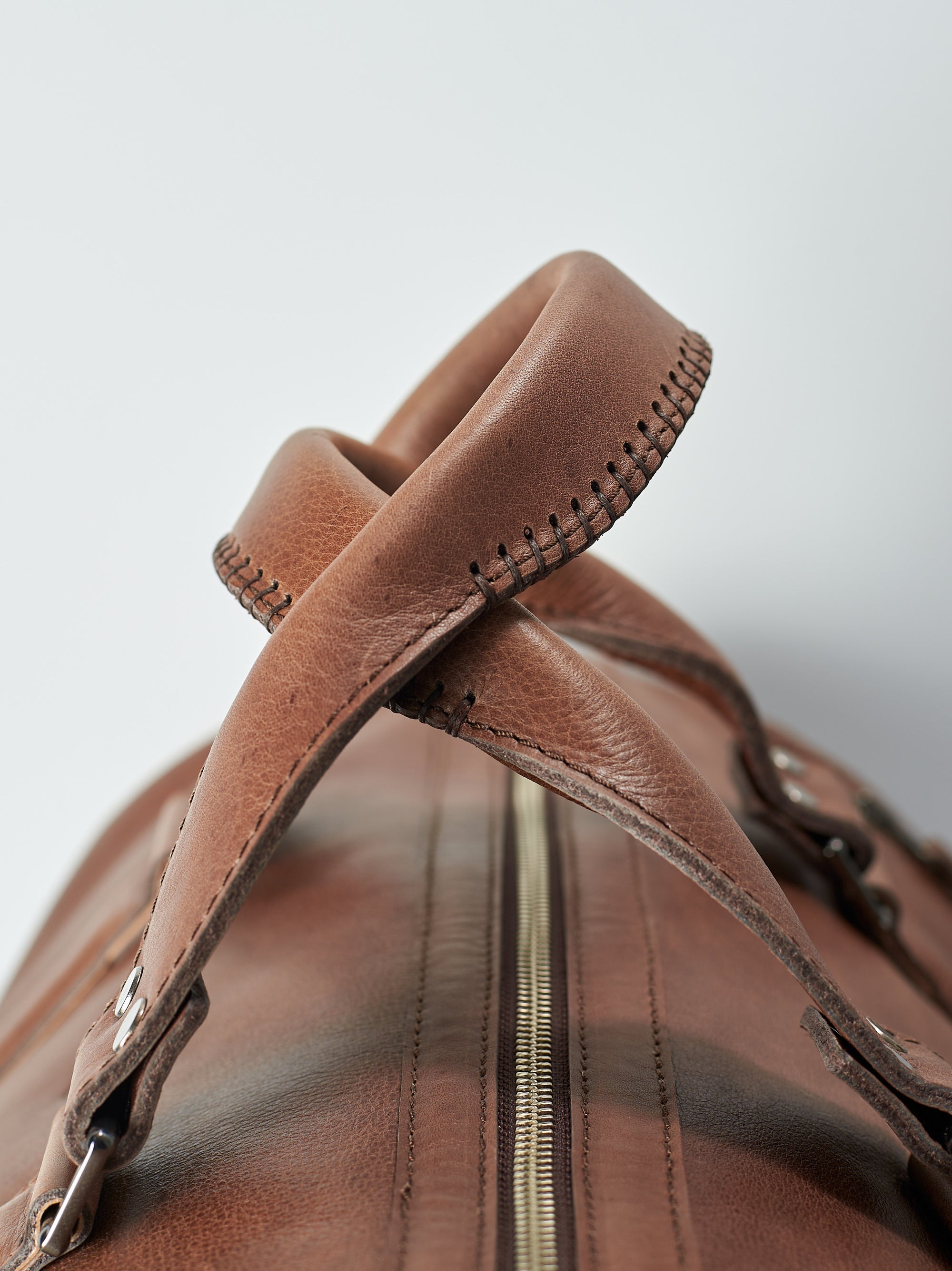 Hand stitched leather handles. Brown leather carryall bag. Mens travel weekender bag