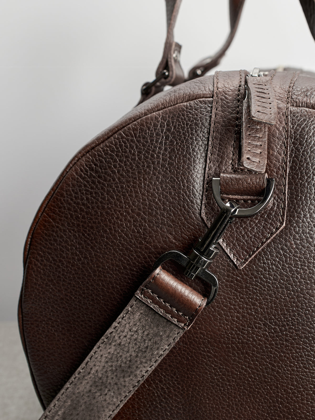 Carrying strap. Dark brown leather carryall bag. Mens travel weekender bag