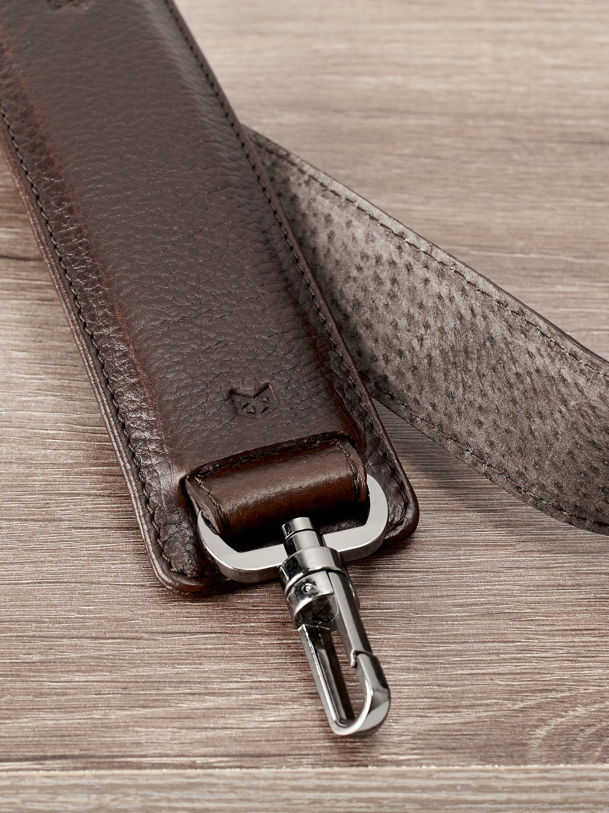 Padded shoulder strap. Dark brown leather carryall bag. Mens travel weekender bag