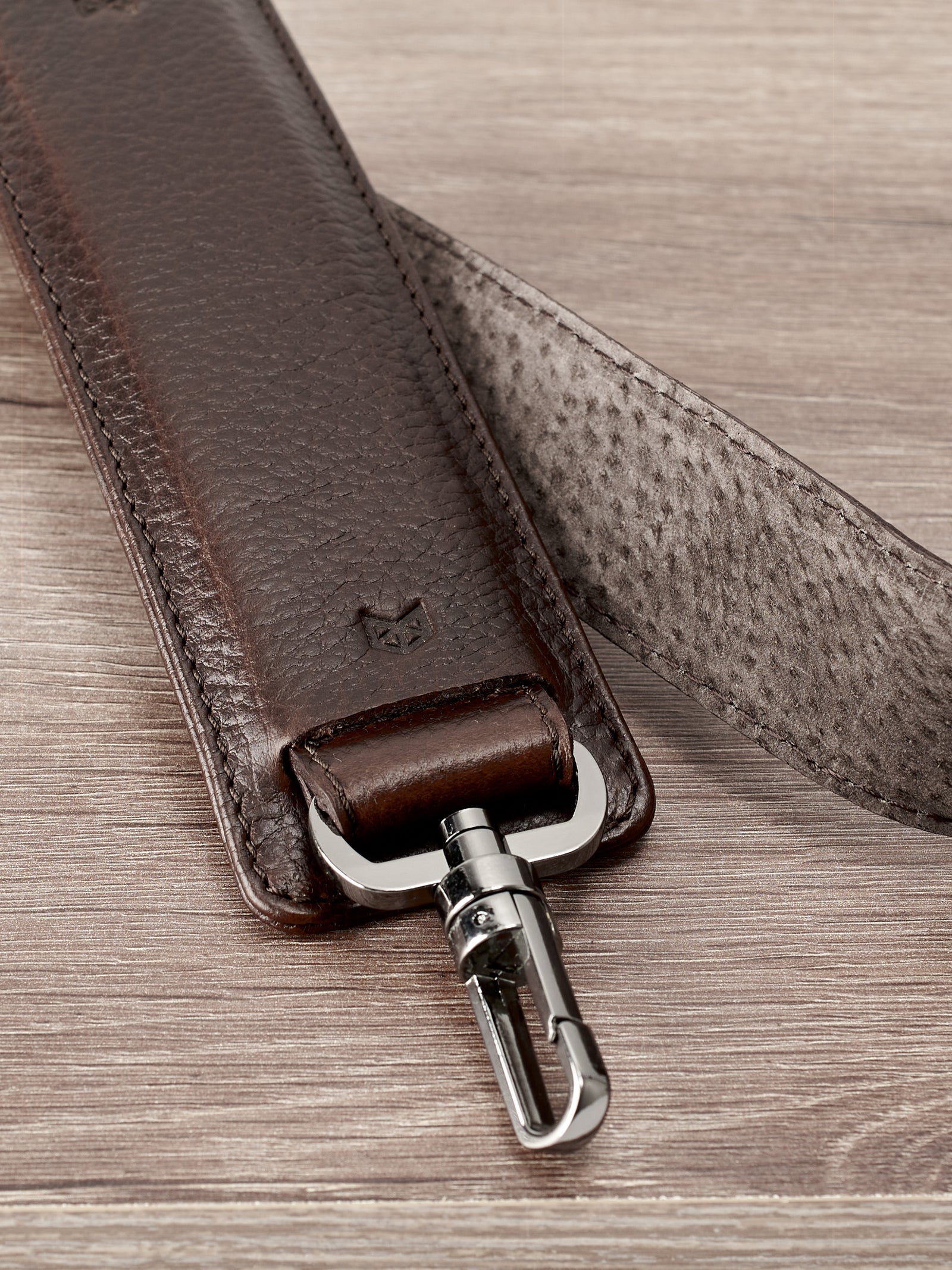 Padded shoulder strap. Dark brown leather carryall bag. Mens travel weekender bag