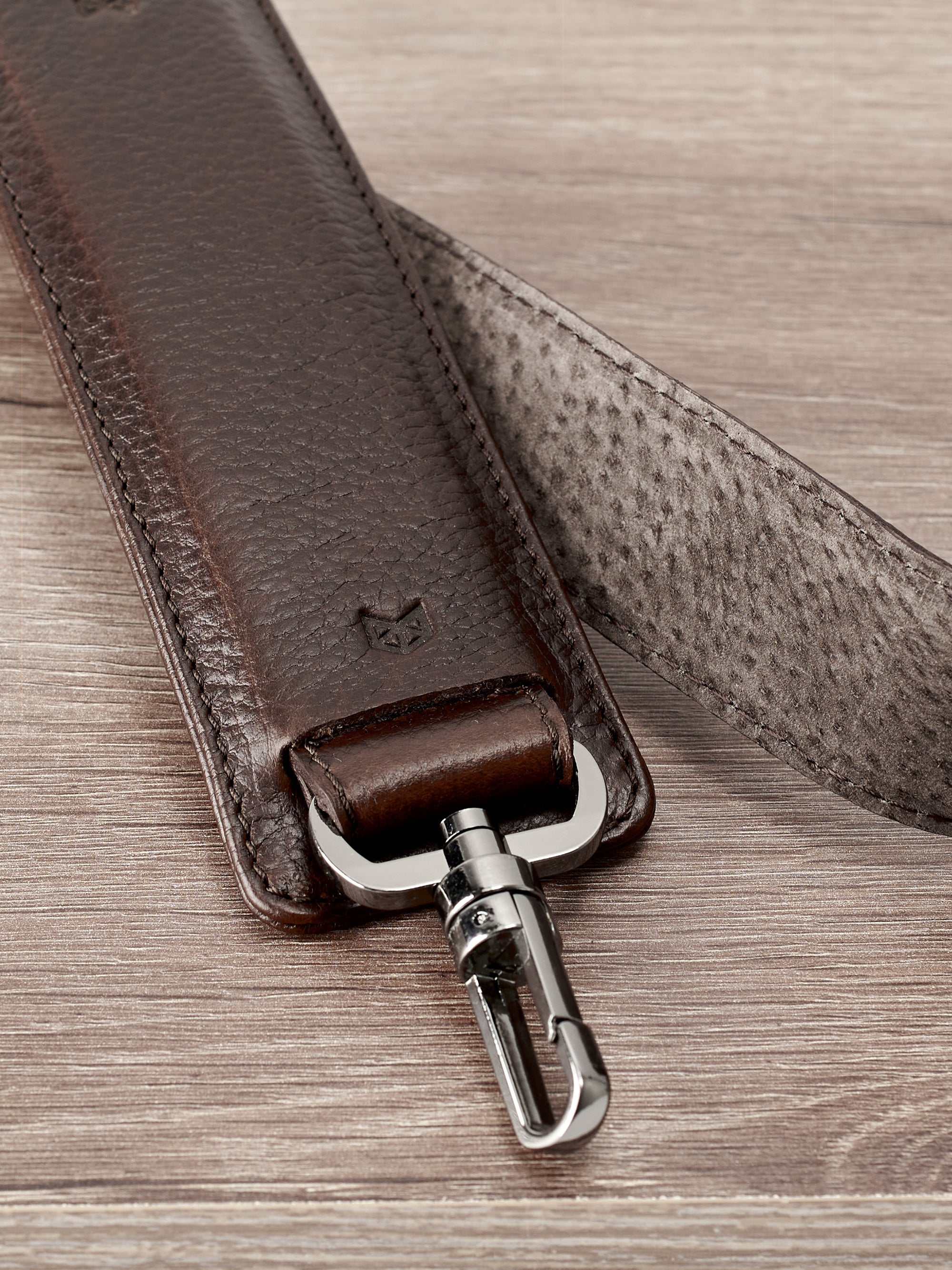 Padded shoulder strap. Dark brown leather carryall bag. Mens travel weekender bag