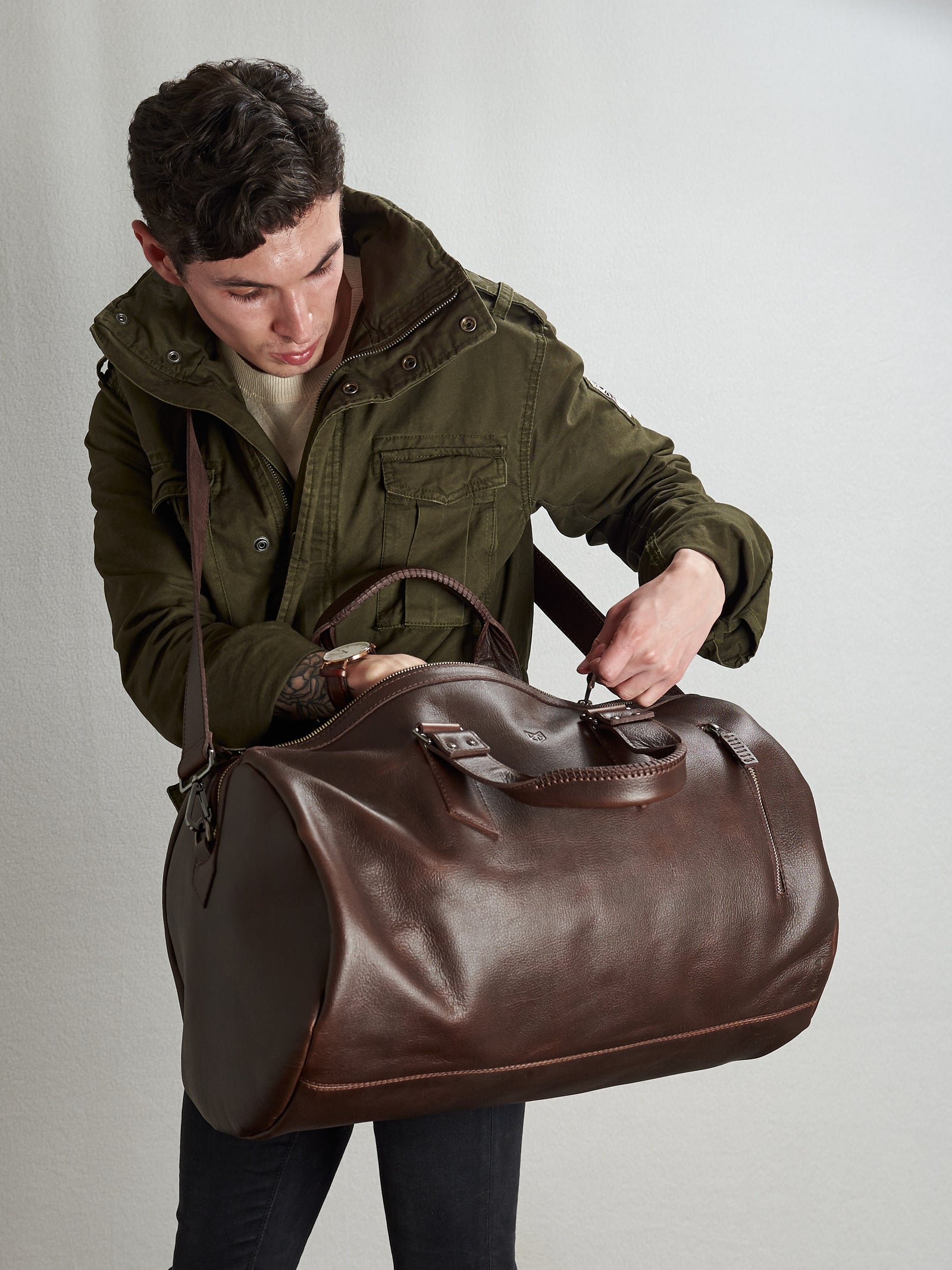Substantial dark brown duffle bag by Capra Leather. Style inside picture.