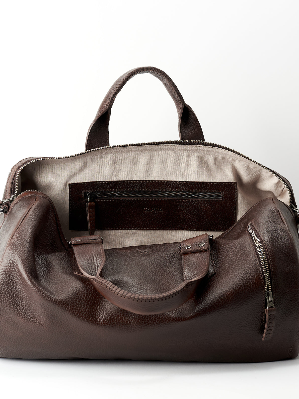Linen interior. Dark brown leather handbag duffle bag for men