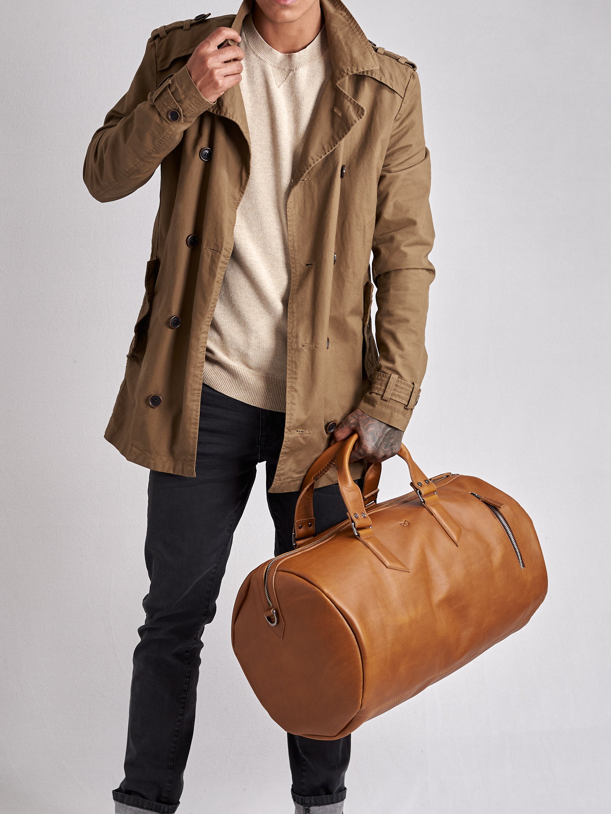 Substantial duffle bag tan by Capra Leather. Style semi side carry. 