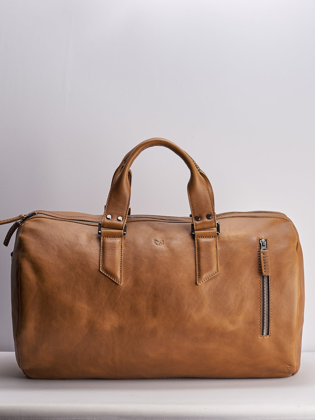 Handmade Tan brown leather duffle bag for men. Mens designer shoulder bag