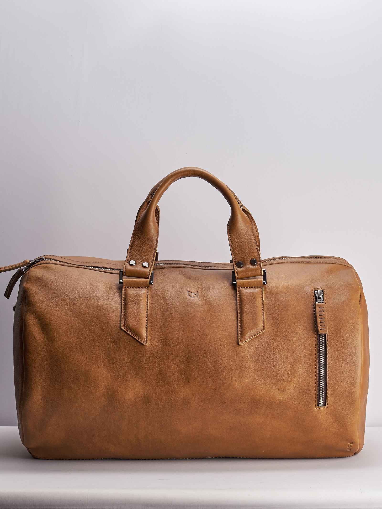 Handmade Tan brown leather duffle bag for men. Mens designer shoulder bag