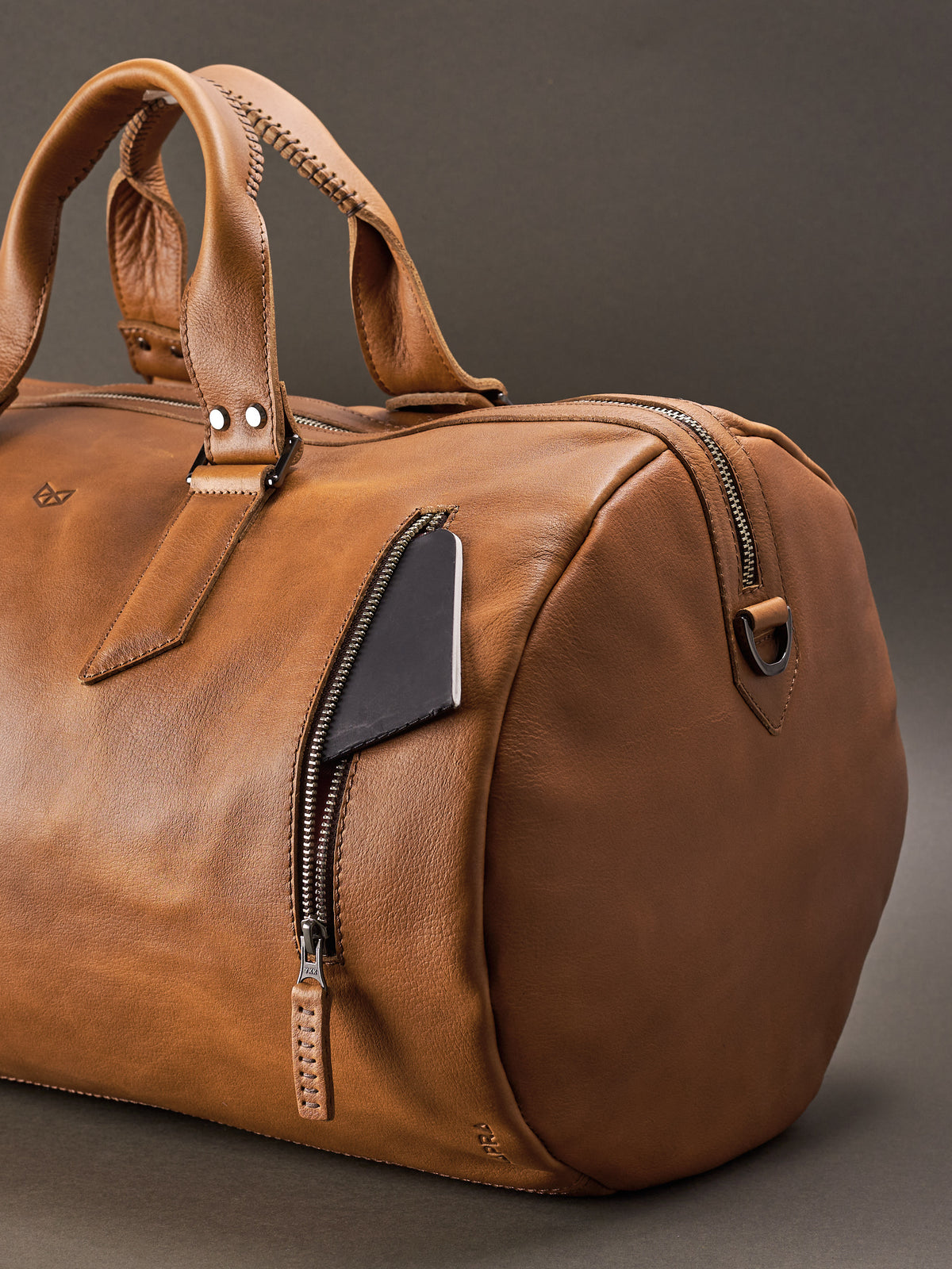 Front pocket. Handmade Tan brown leather duffle bag for men. Mens designer shoulder bag