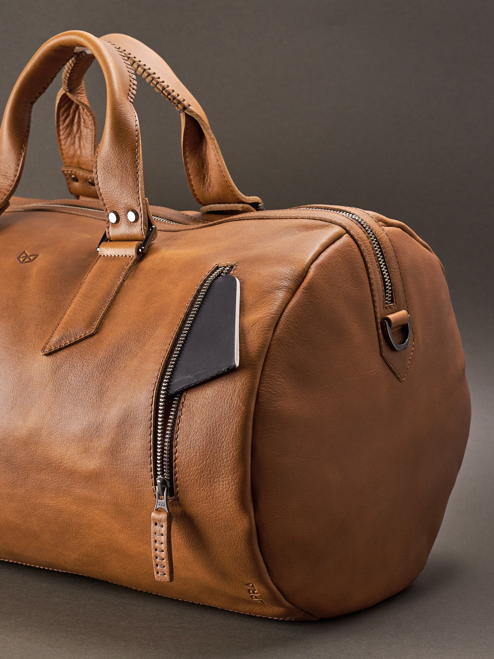 Front pocket. Handmade Tan brown leather duffle bag for men. Mens designer shoulder bag