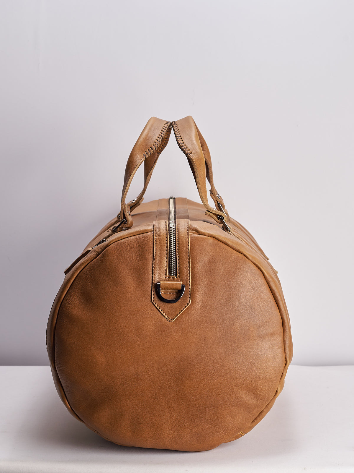 Angle. Handmade tan leather work out bag. Athletic gym bag for men