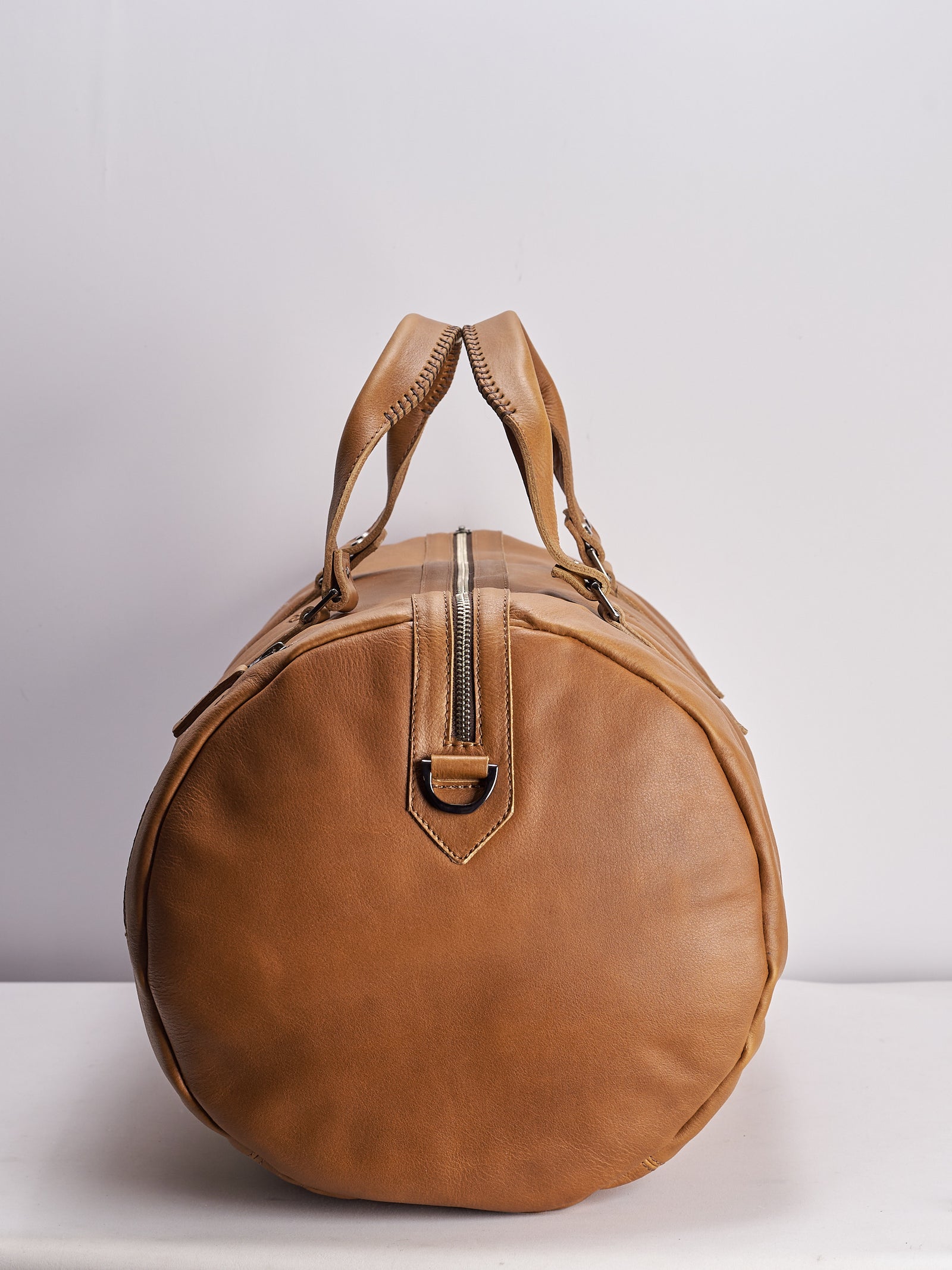 Angle. Handmade tan leather work out bag. Athletic gym bag for men