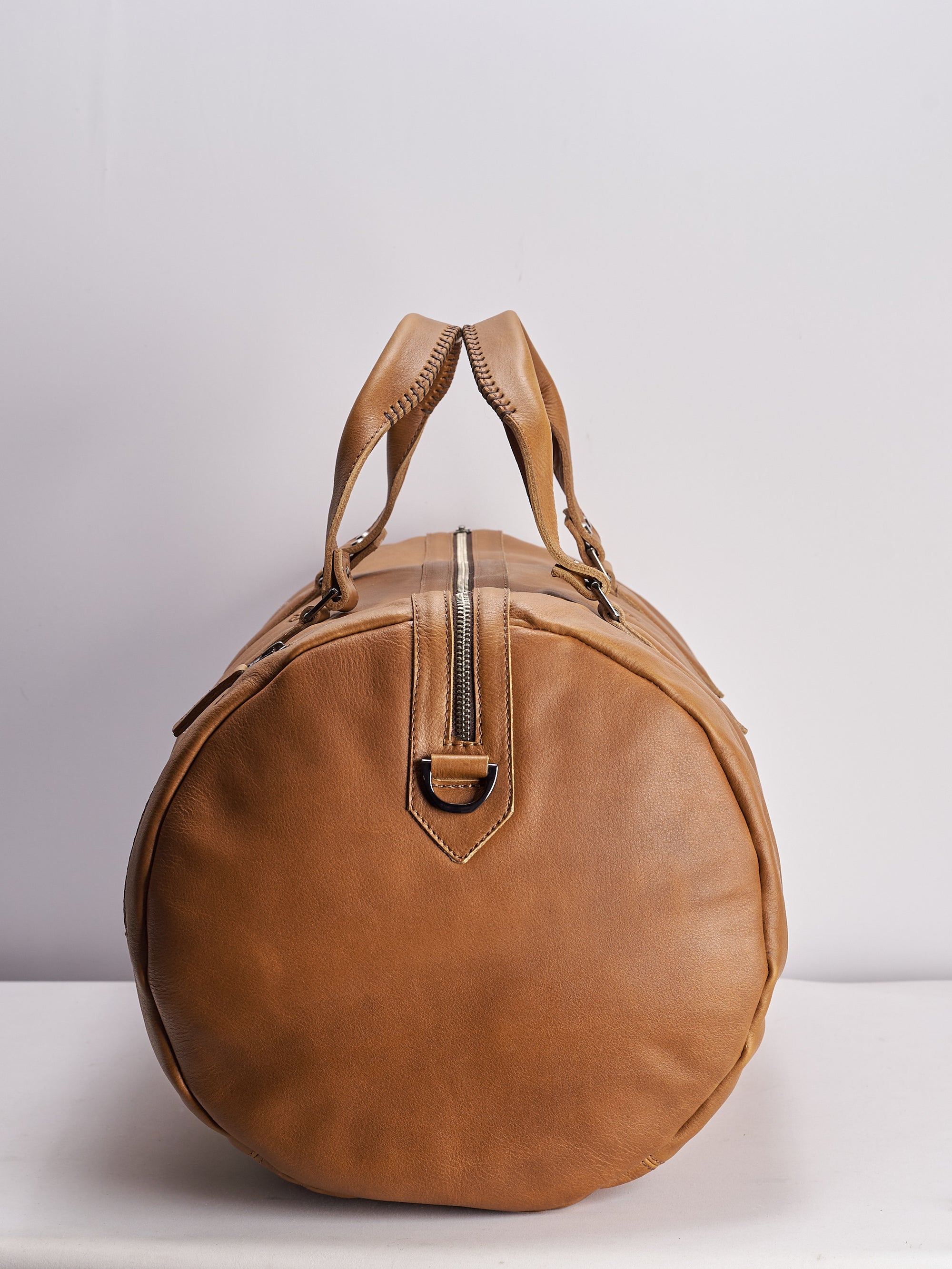 Angle. Handmade tan leather work out bag. Athletic gym bag for men