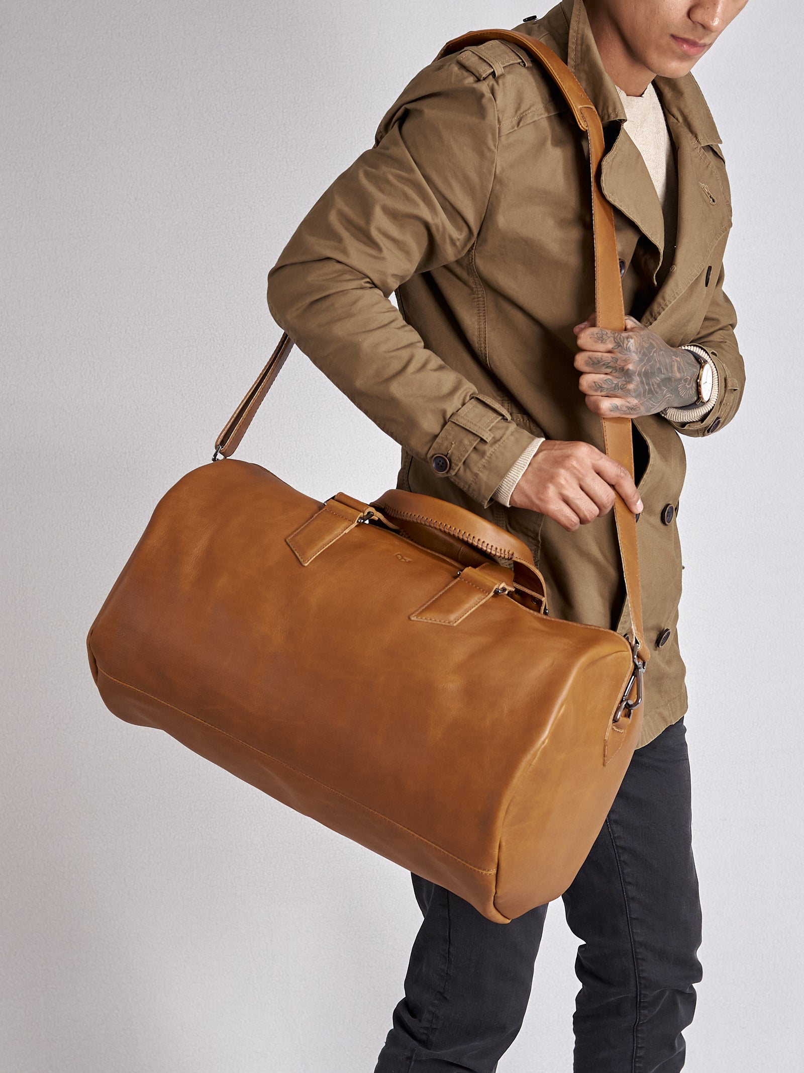 Substantial duffle bag tan by Capra Leather. Strap style carry bag.
