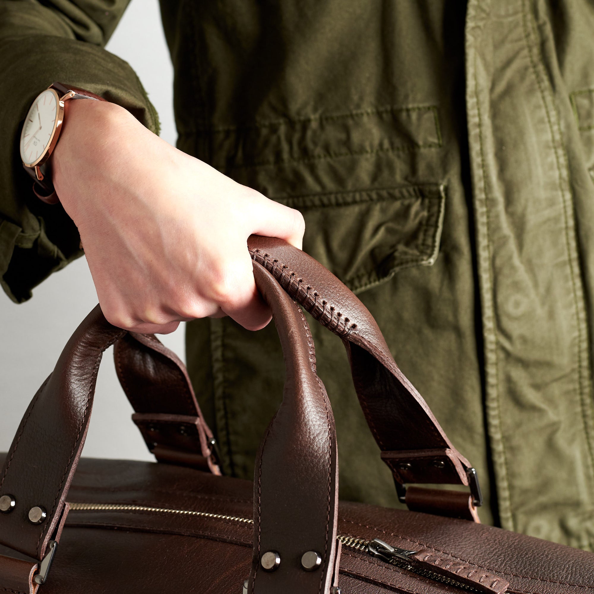 Style handles detail. Substantial dark brown duffle bag by Capra Leather.