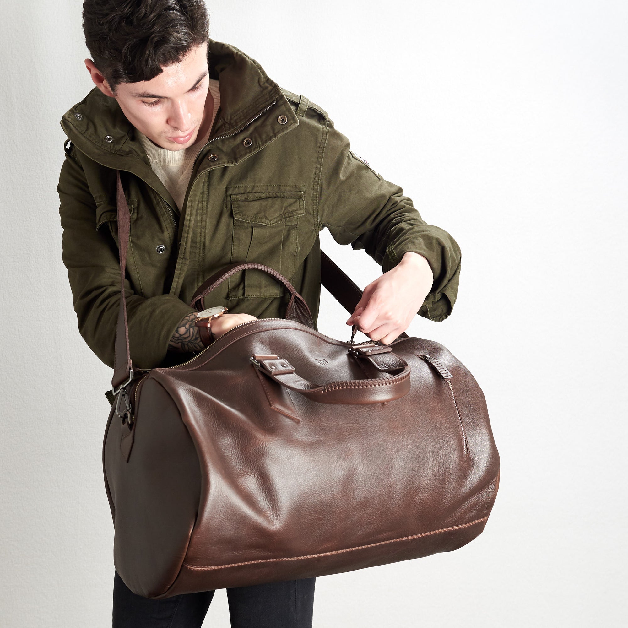 Substantial dark brown duffle bag by Capra Leather. Style inside picture.