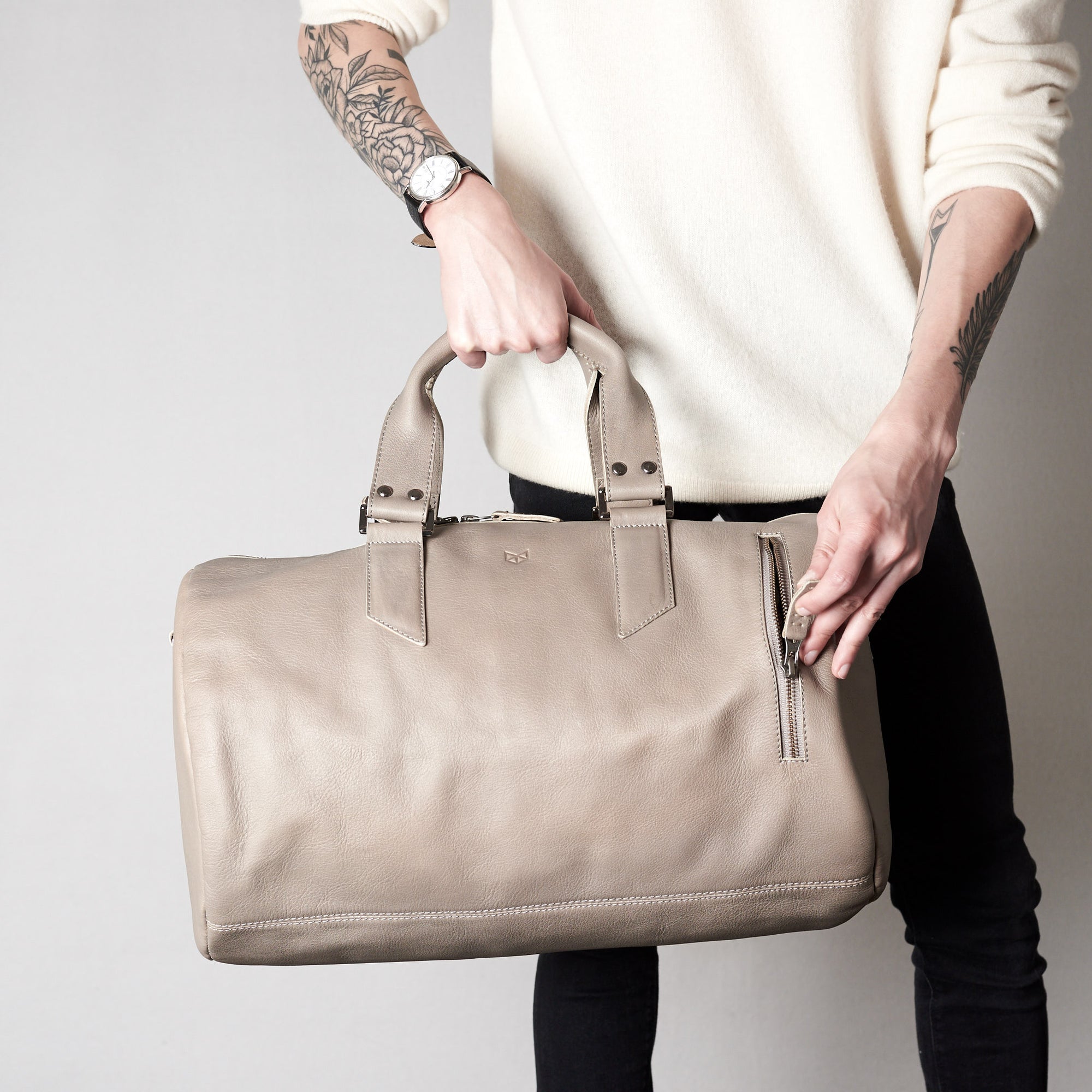 Style front pocket. Substantial grey duffle bag by Capra Leather. 