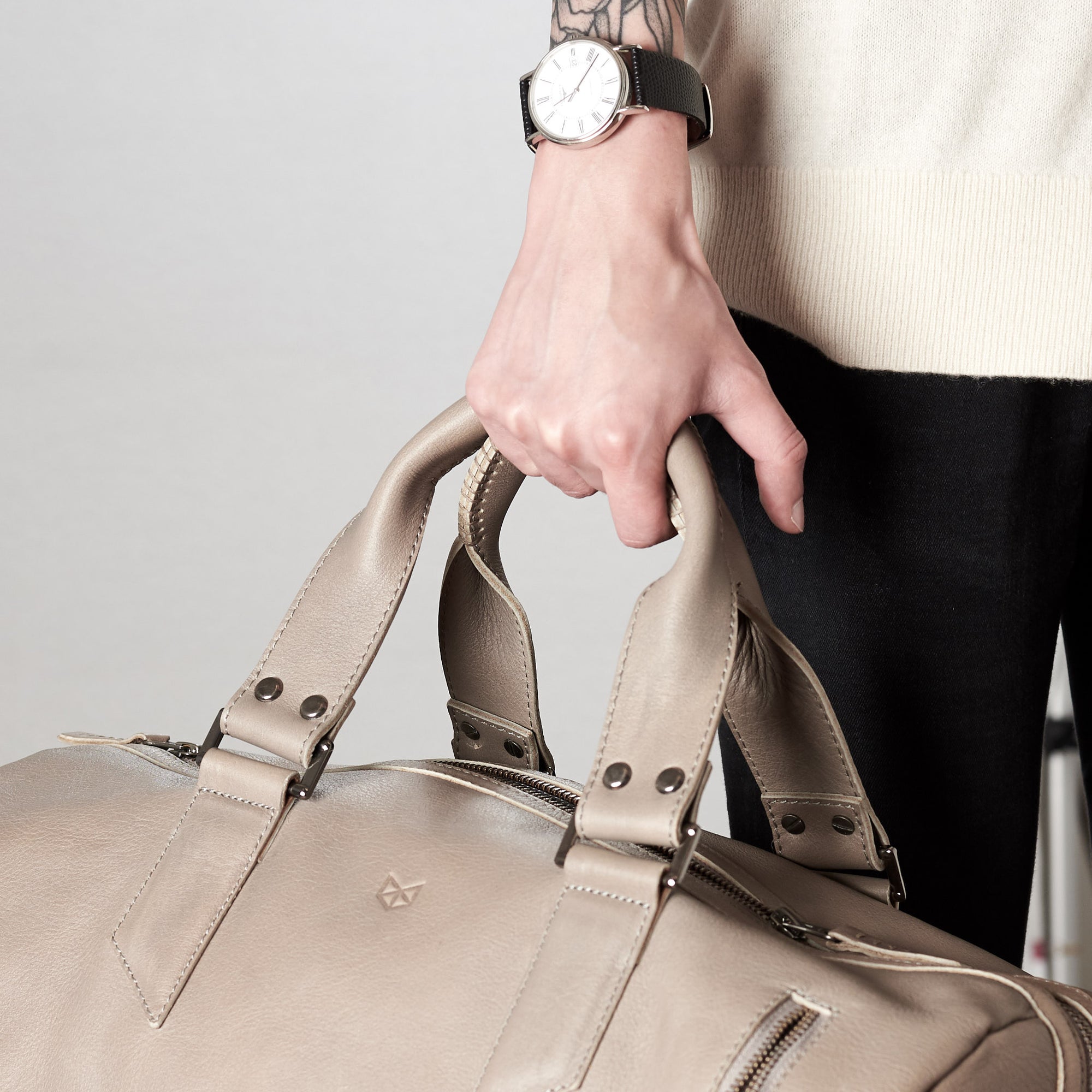 Style handles detail. Substantial grey duffle bag by Capra Leather. 