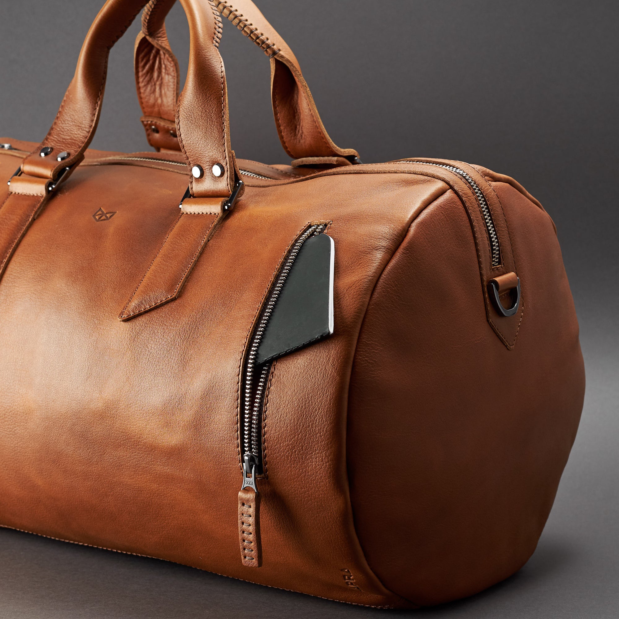 Front pocket. Handmade Tan brown leather duffle bag for men. Mens designer shoulder bag