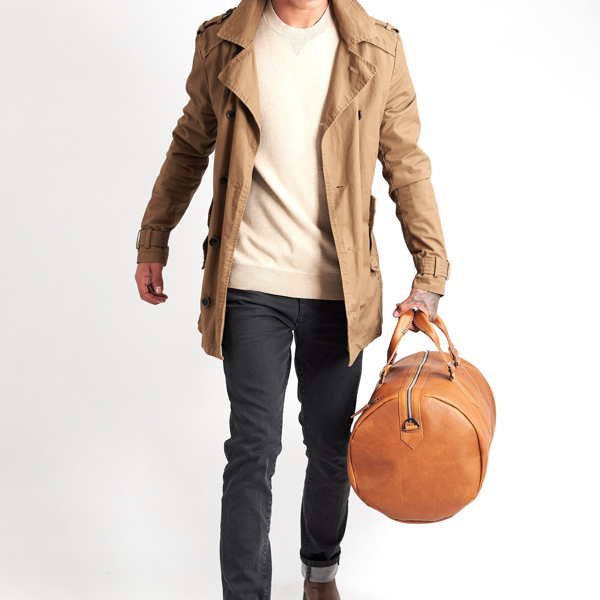 Substantial duffle bag tan by Capra Leather. Style side carry. 