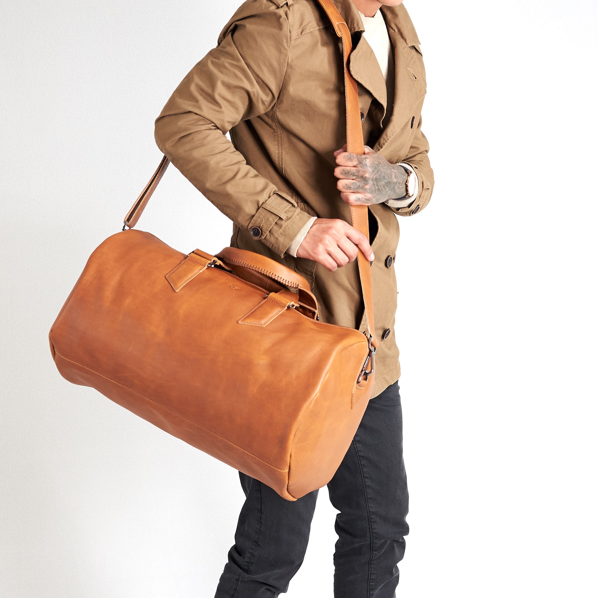 Substantial duffle bag tan by Capra Leather. Strap style carry bag.