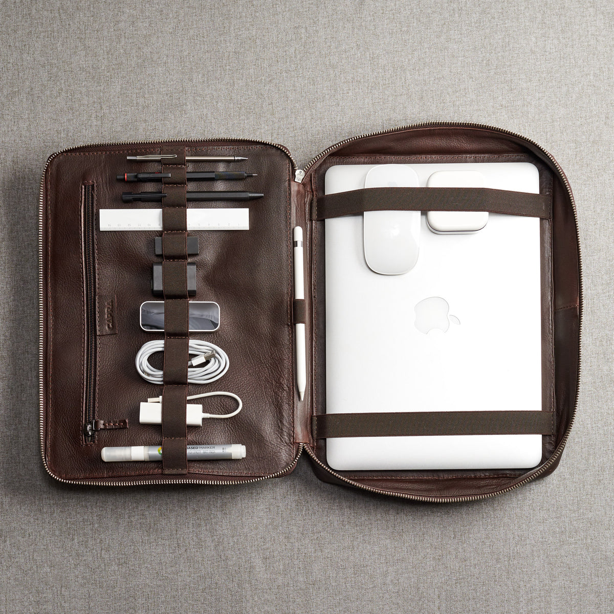 Handmade gear bag with leather interior. Dark brown tech organizer travel by Capra Leather. Fits laptop 15 inch