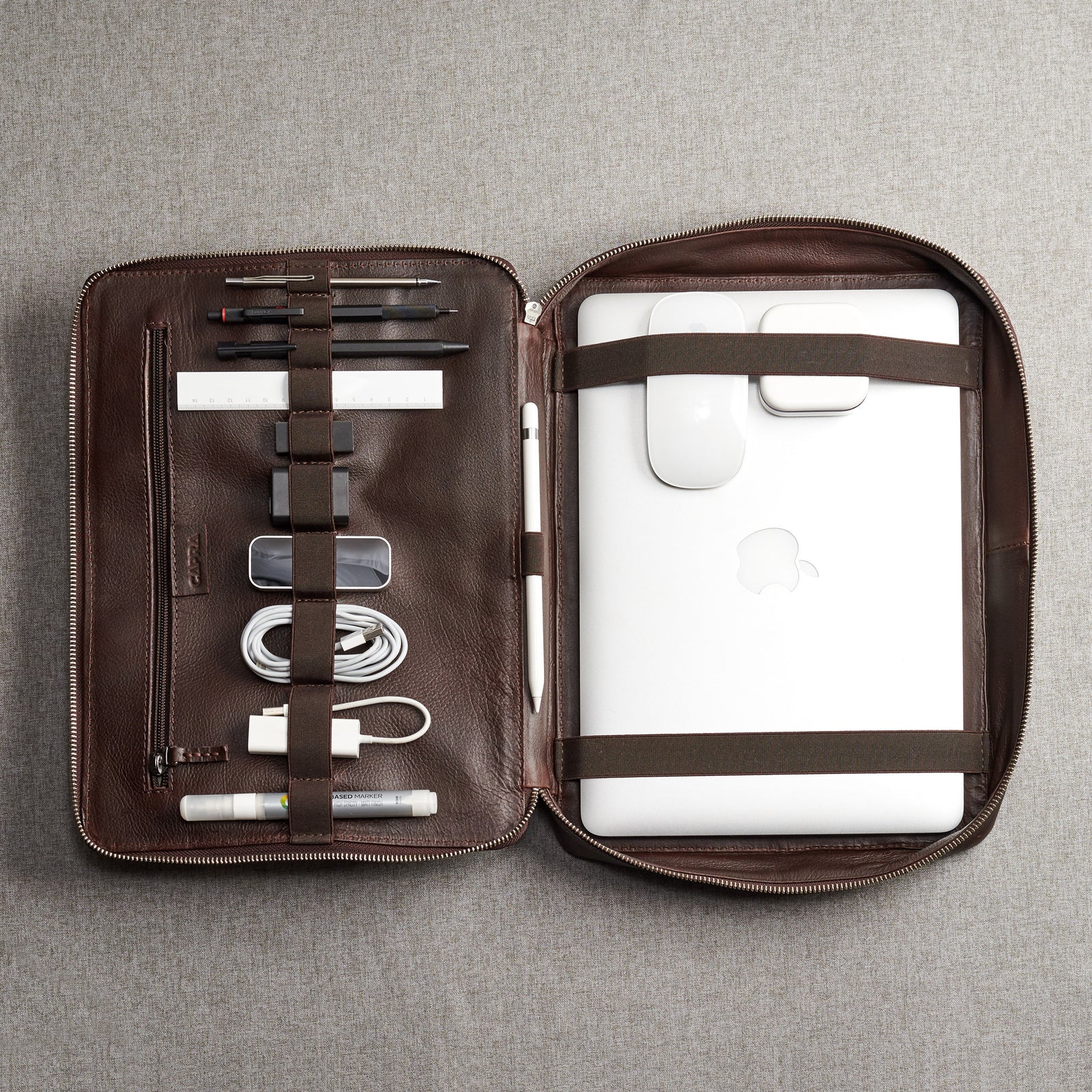 Handmade gear bag with leather interior. Dark brown tech organizer travel by Capra Leather. Fits laptop 15 inch