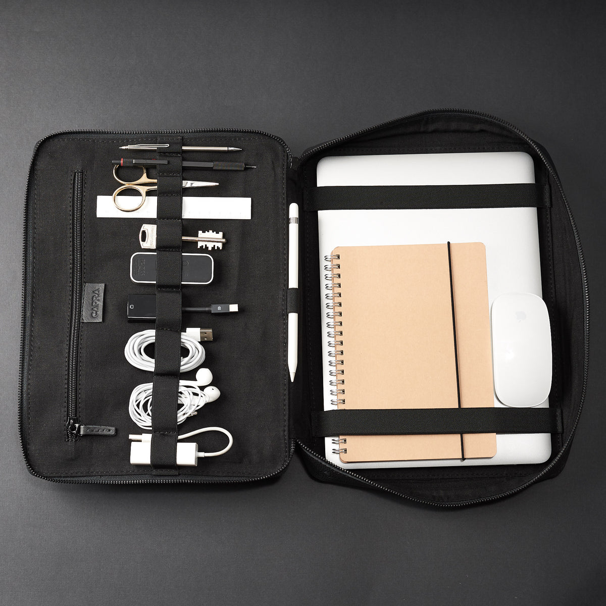 Elastic slots for cables. Black tech organizer by Capra Leather