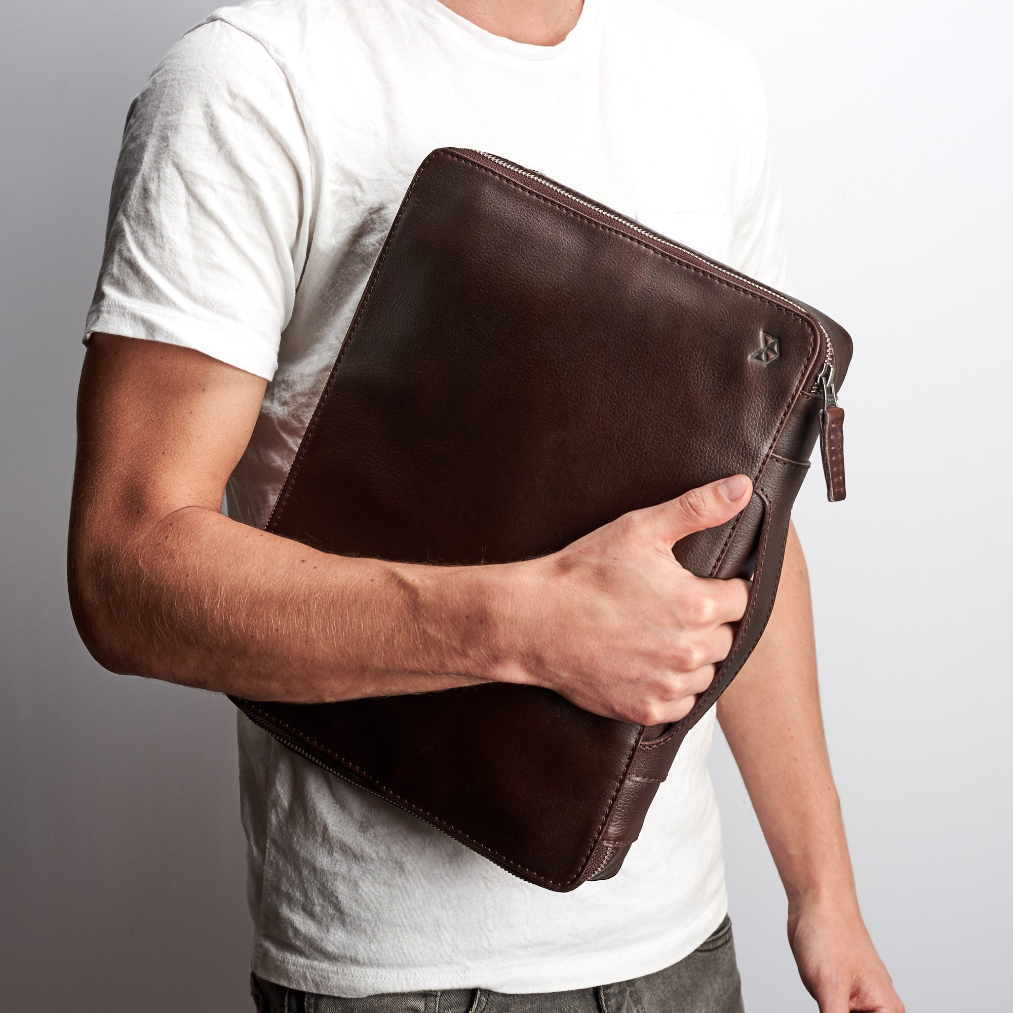  Sleek tech bags for men. Dark brown gadget organizer by Capra Leather. Fits laptop 15 inch