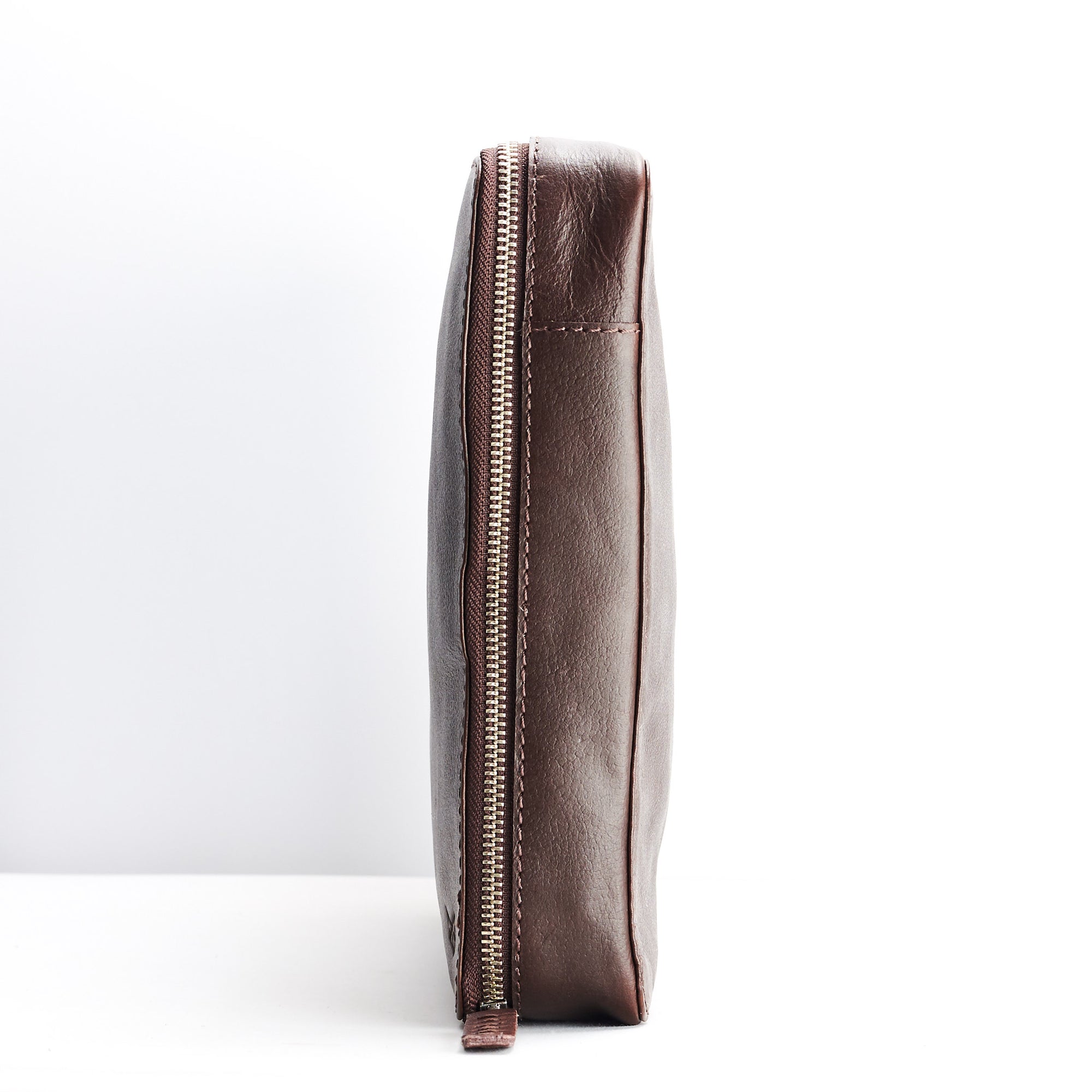 Slim profile. Dark brown travel gadget organizer by Capra Leather