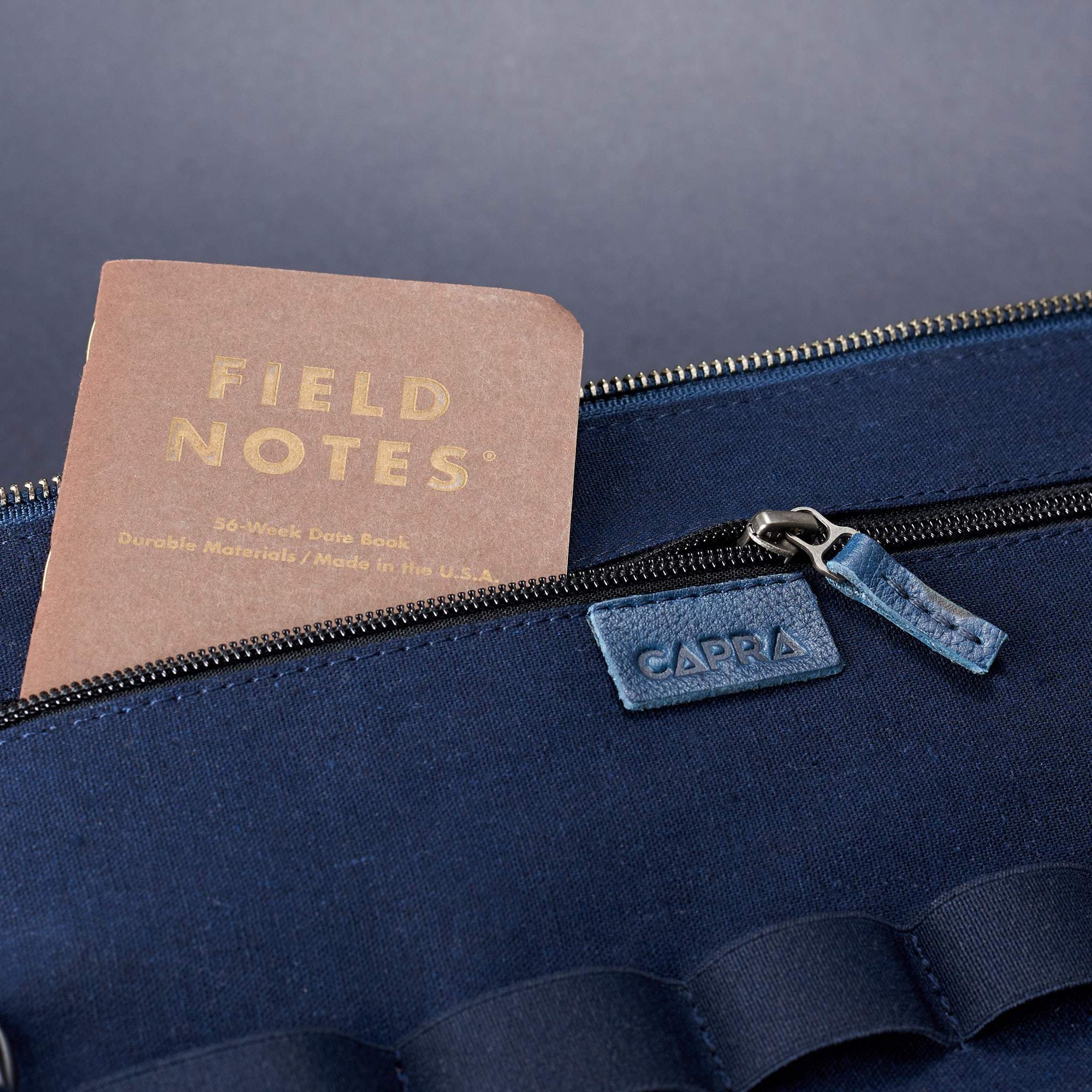 Interior zipper pocket. Best travel tech organizer navy blue by Capra Leather