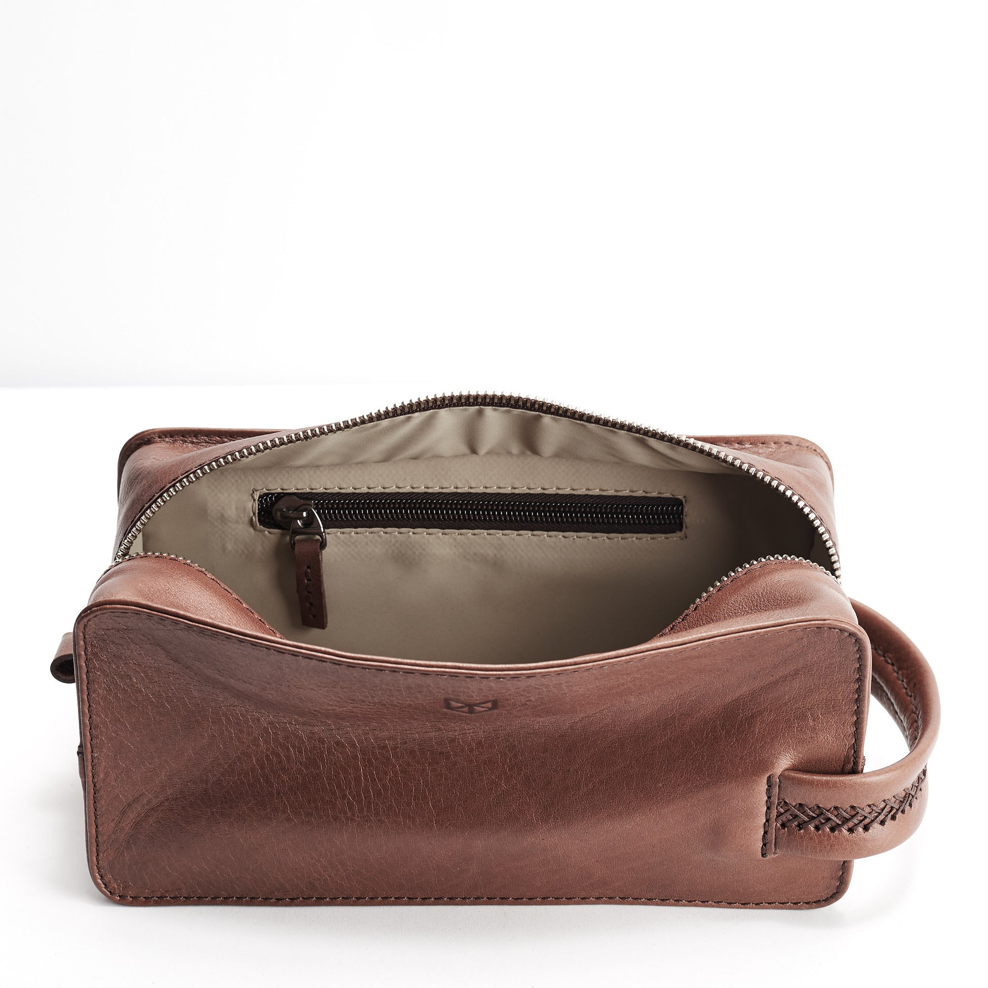 Leather toiletry bag with interior pocket for small essentials. Brown leather shaving bag for mens gifts