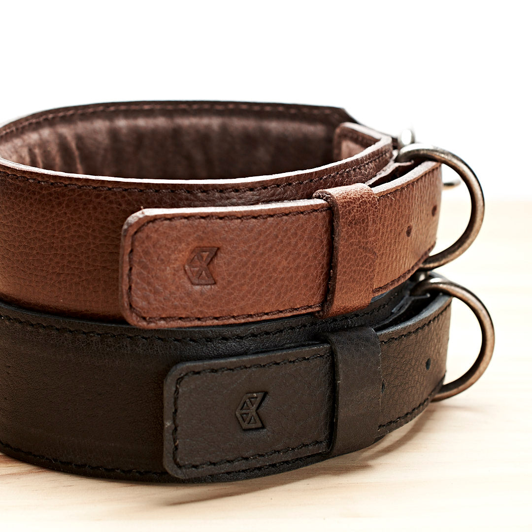 Handmade minimal black and dark brown leather padded dog collars by Capra Leather.