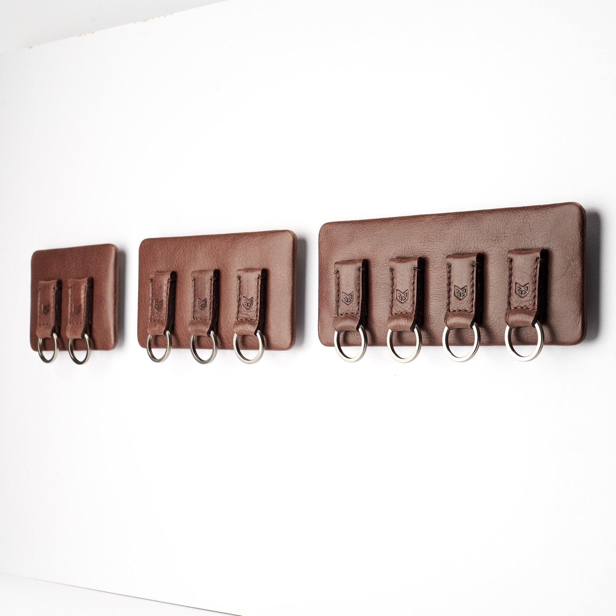 different sizes. Magnetic key hanger organizer. Brown leather magnetic key holder for wall decor. Entryway organizer decor. Home decoration. Keys organizer
