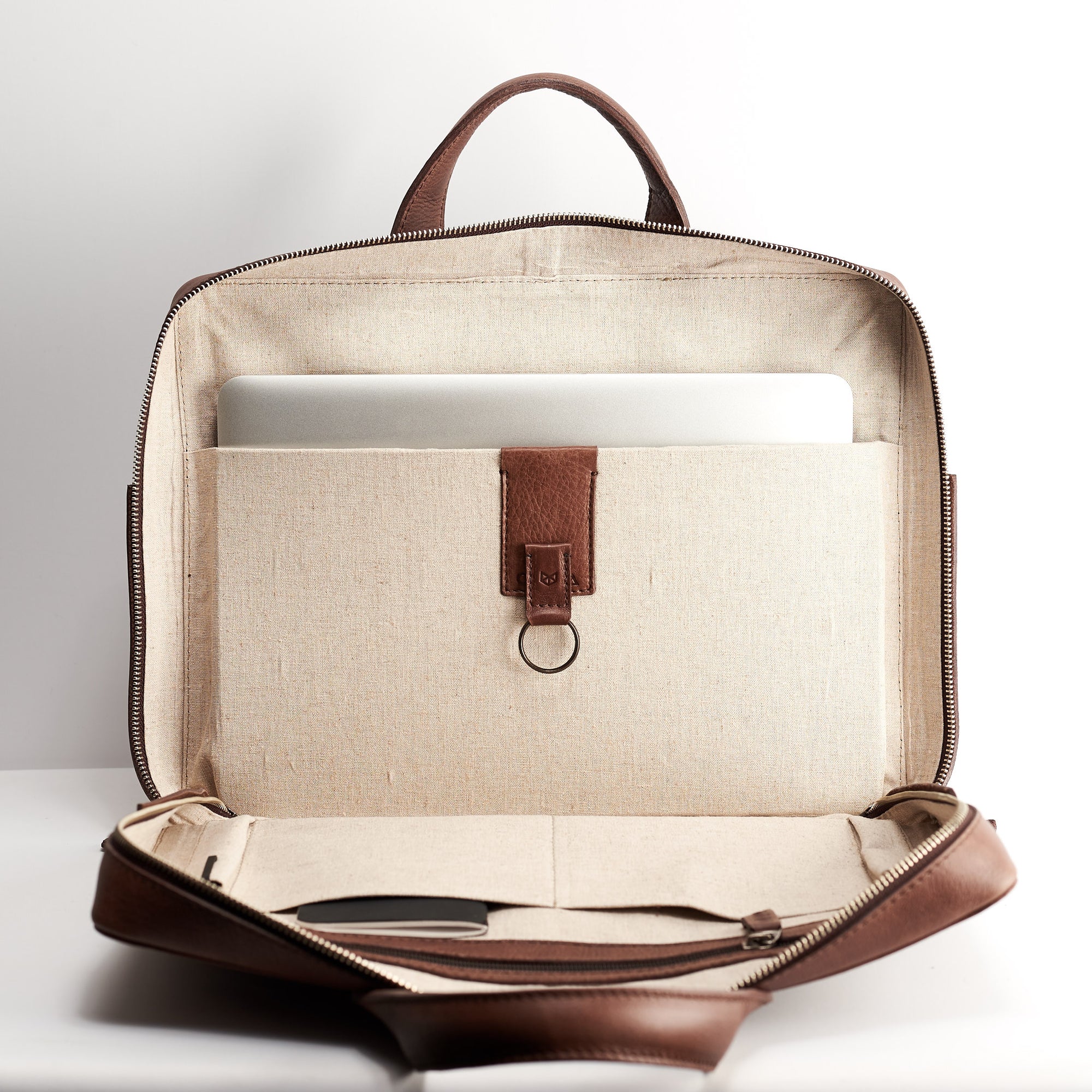 Interior pocket detail. Brown leather briefcase for men. Linen interior. Workbag for Macbook Pro 13inch 15inch