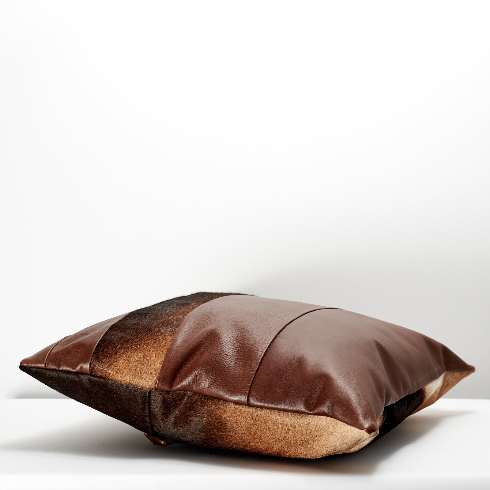 Side. Handmade dual leather cowhide cushion. Perfect lounge decoration. Custom size. Personalized gifts for men. Capra Leather