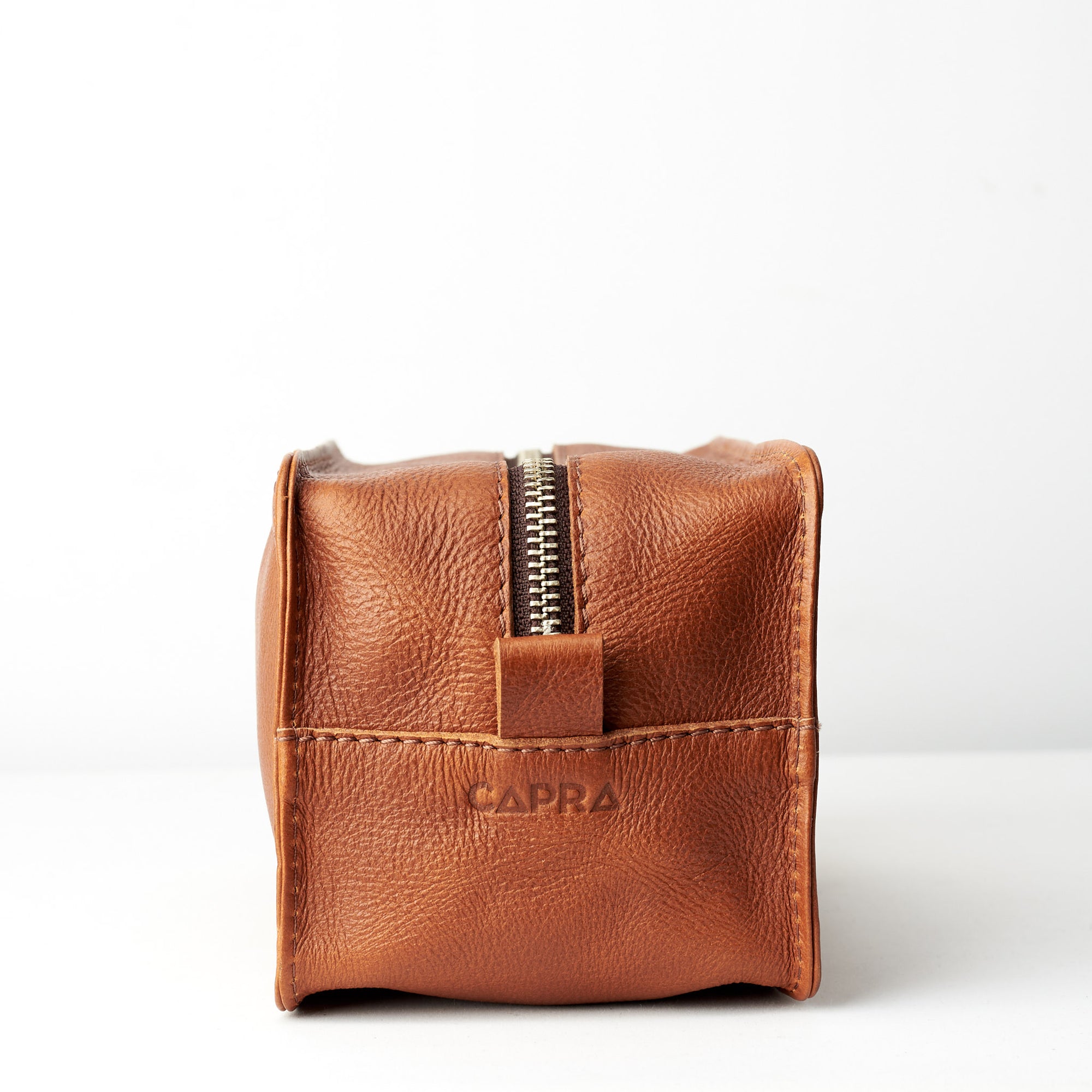 Zipper. Tan leather toiletry, shaving bag with hand stitched handle. Groomsmen gifts. Leather good crafted by Capra Leather 