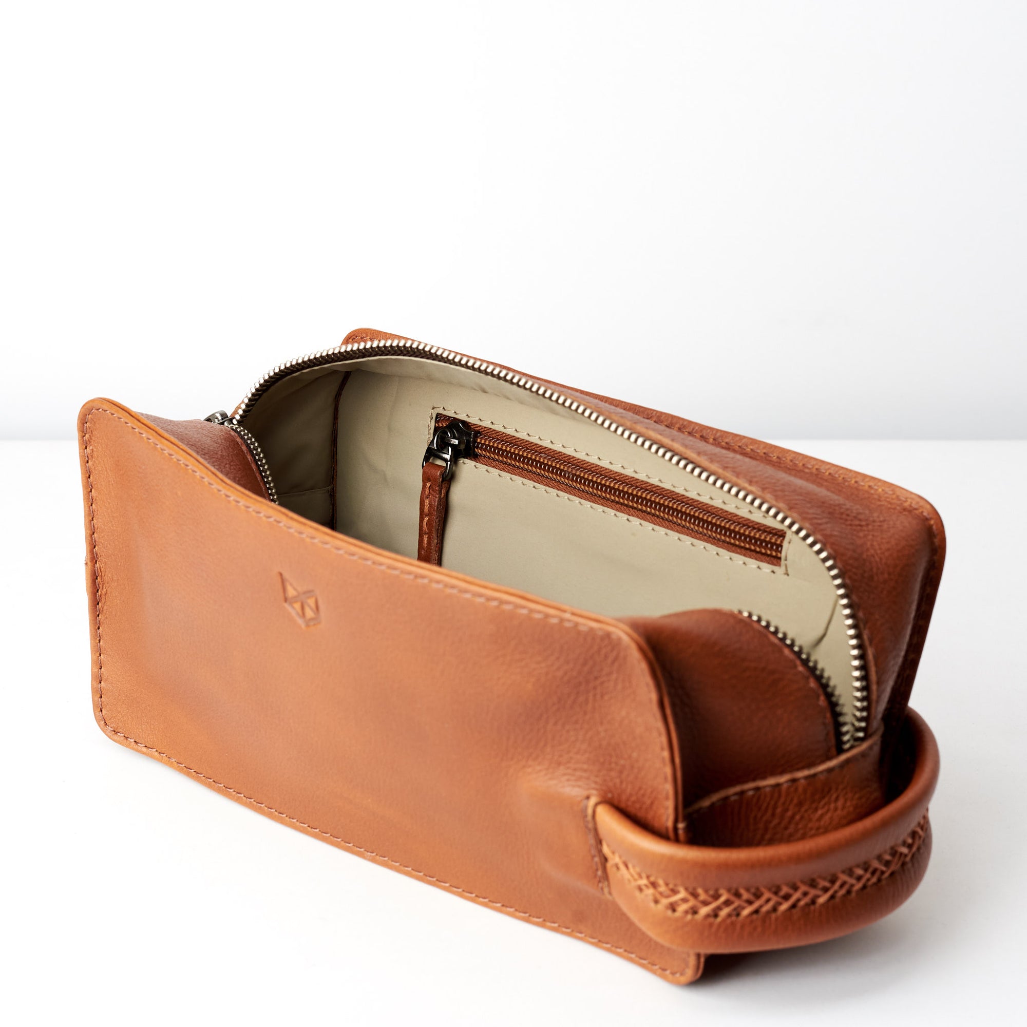 Pocket. Tan leather toiletry, shaving bag with hand stitched handle. Groomsmen gifts. Leather good crafted by Capra Leather 