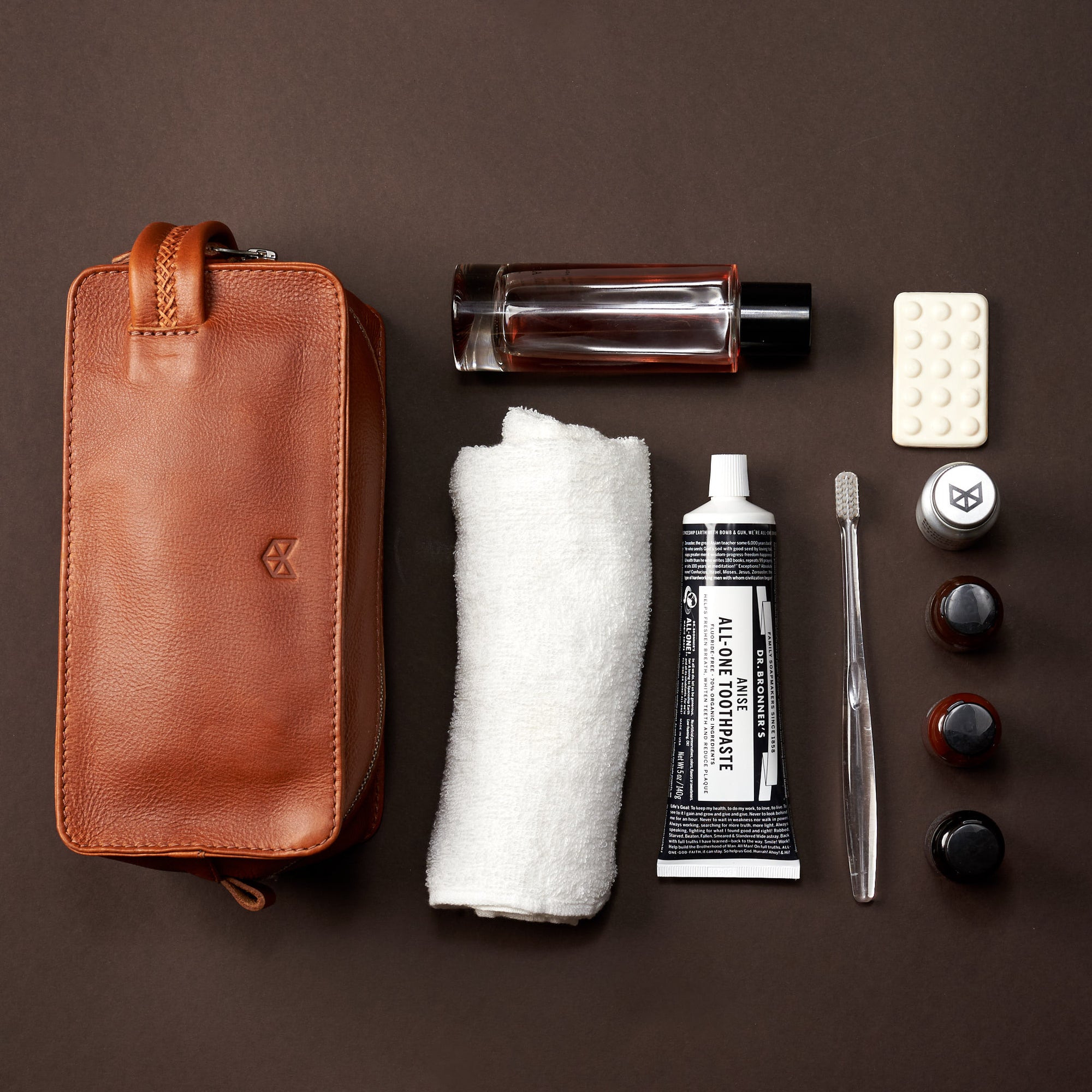 Squared styling. Tan leather toiletry, shaving bag with hand stitched handle. Groomsmen gifts. Leather good crafted by Capra Leather 