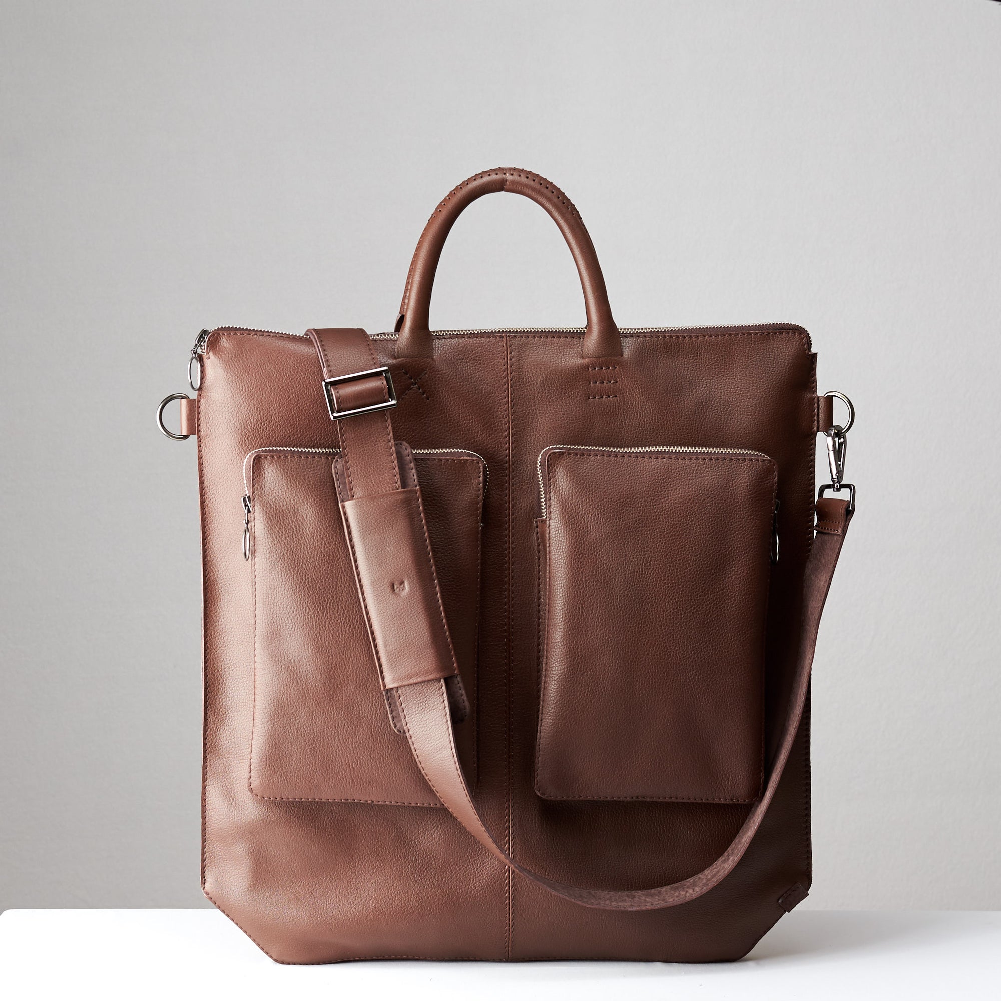 Front view detachable shoulder strap. Brown tote zipper bag by Capra Leather. Handmade men work bag.